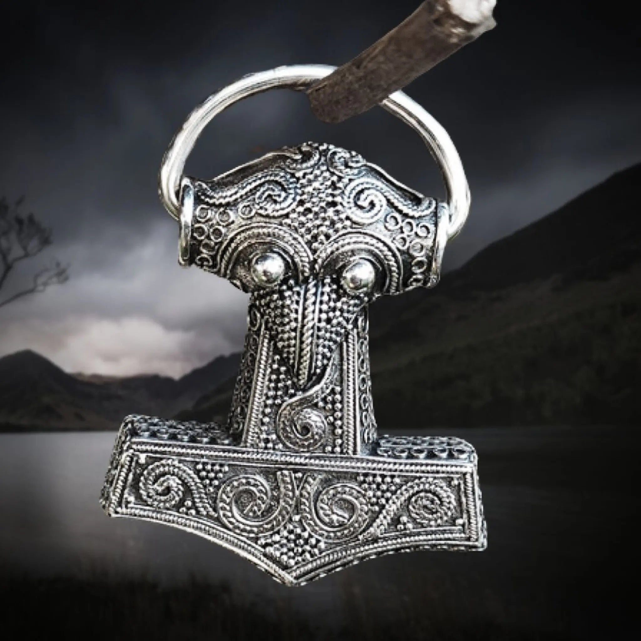 Silver Filigree Thors Hammer Pendant Replica from Kabara on Dark Lake Background