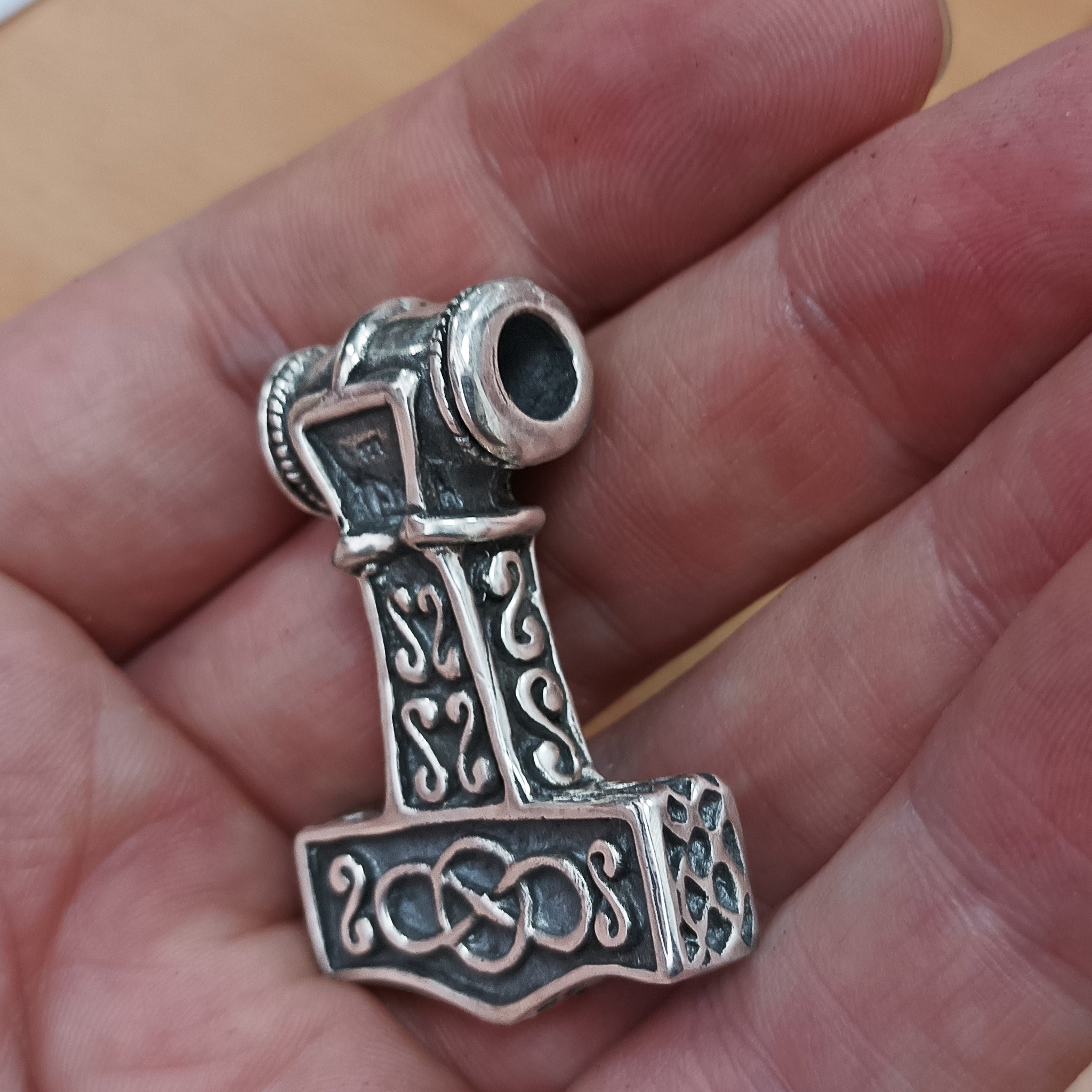 Silver Thors Thunder Hammer Pendant on Hand- Angled Back View