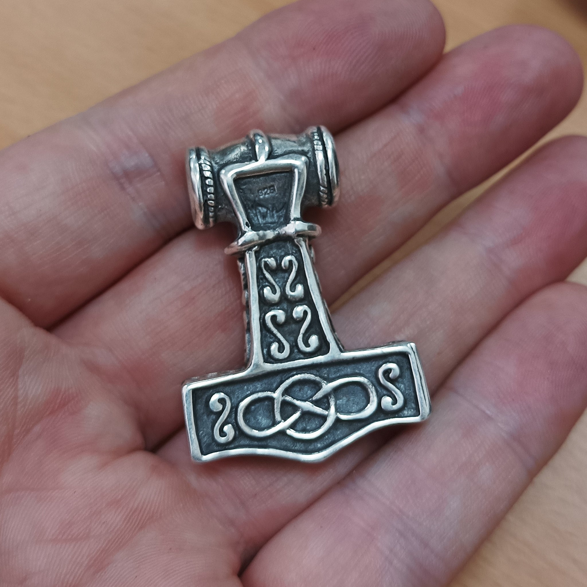 Silver Thors Thunder Hammer Pendant on Hand - Back View