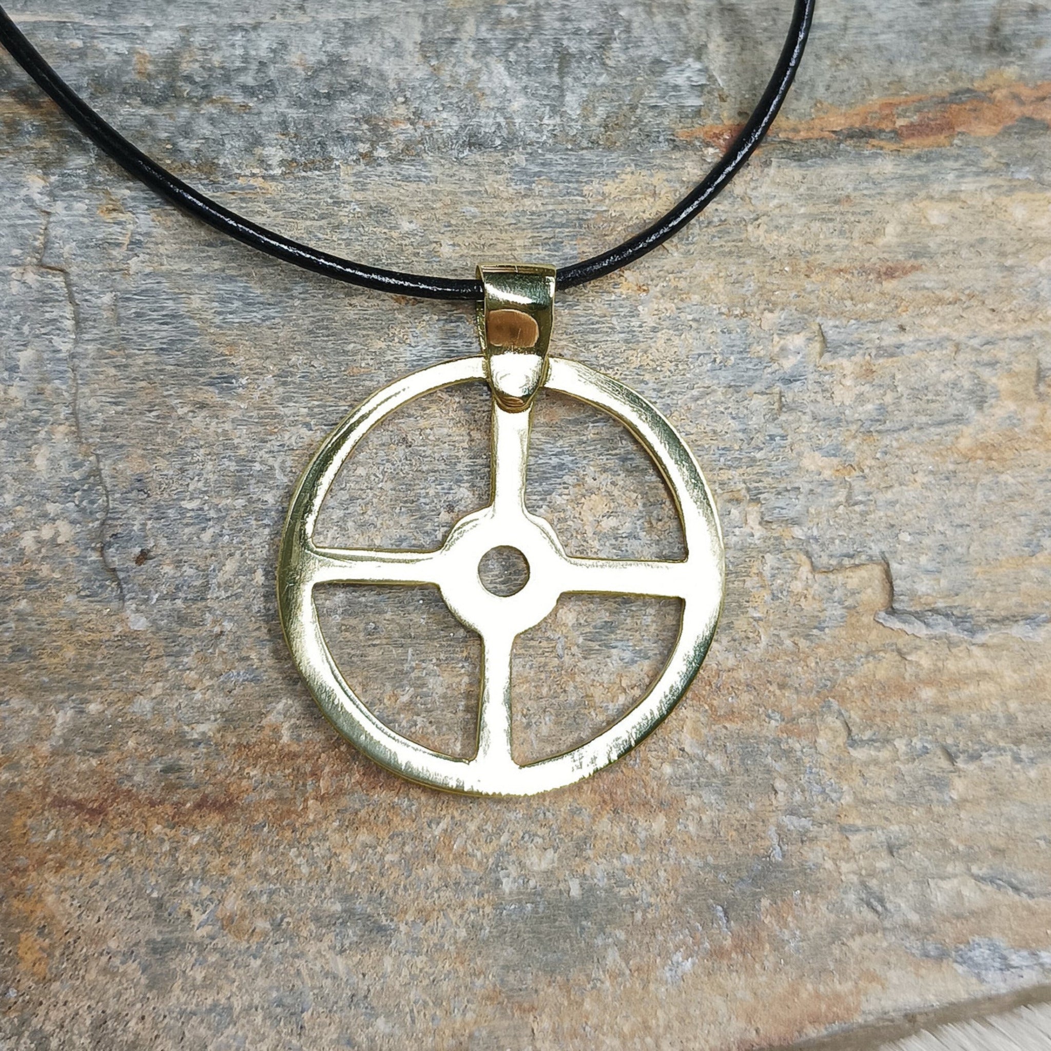 Large Brass Sun Cross Odin Pendant on Rock