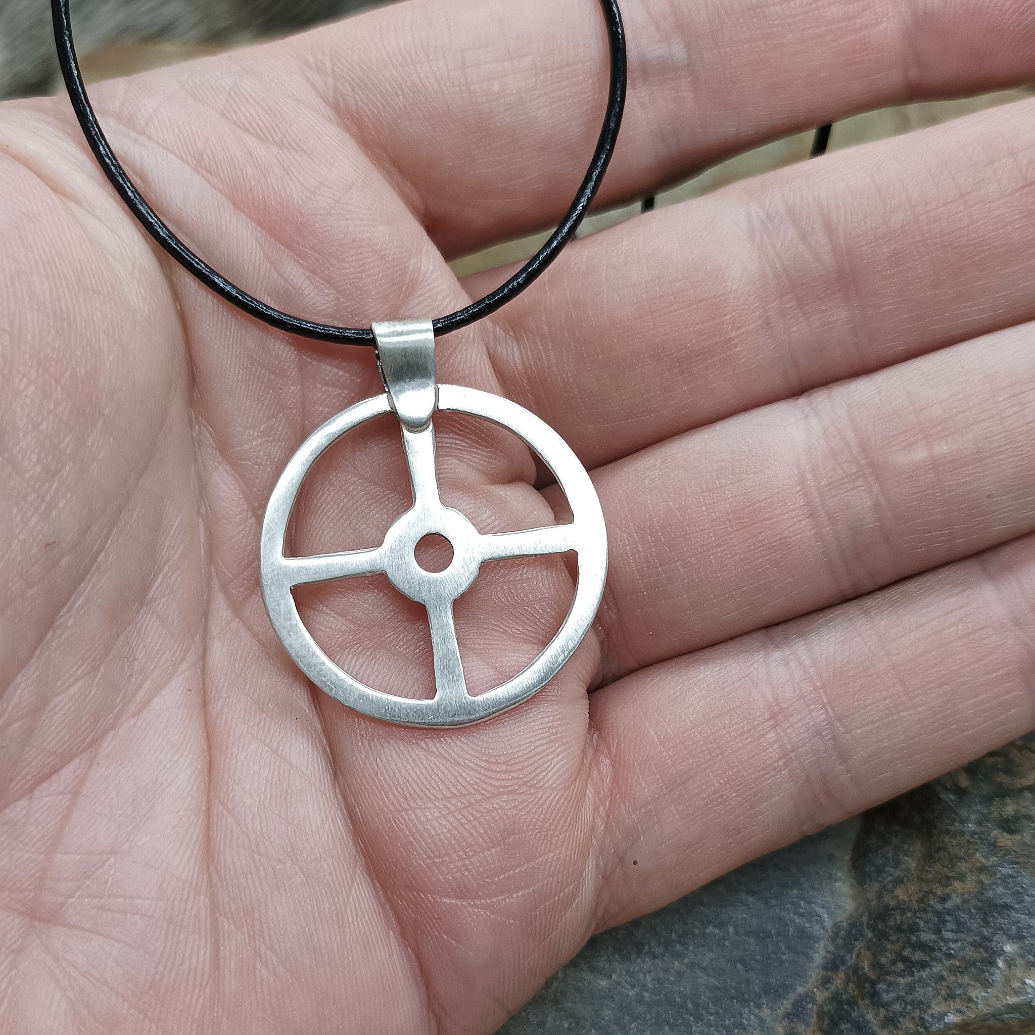 Silver Sun Cross Odin Pendant on Hand