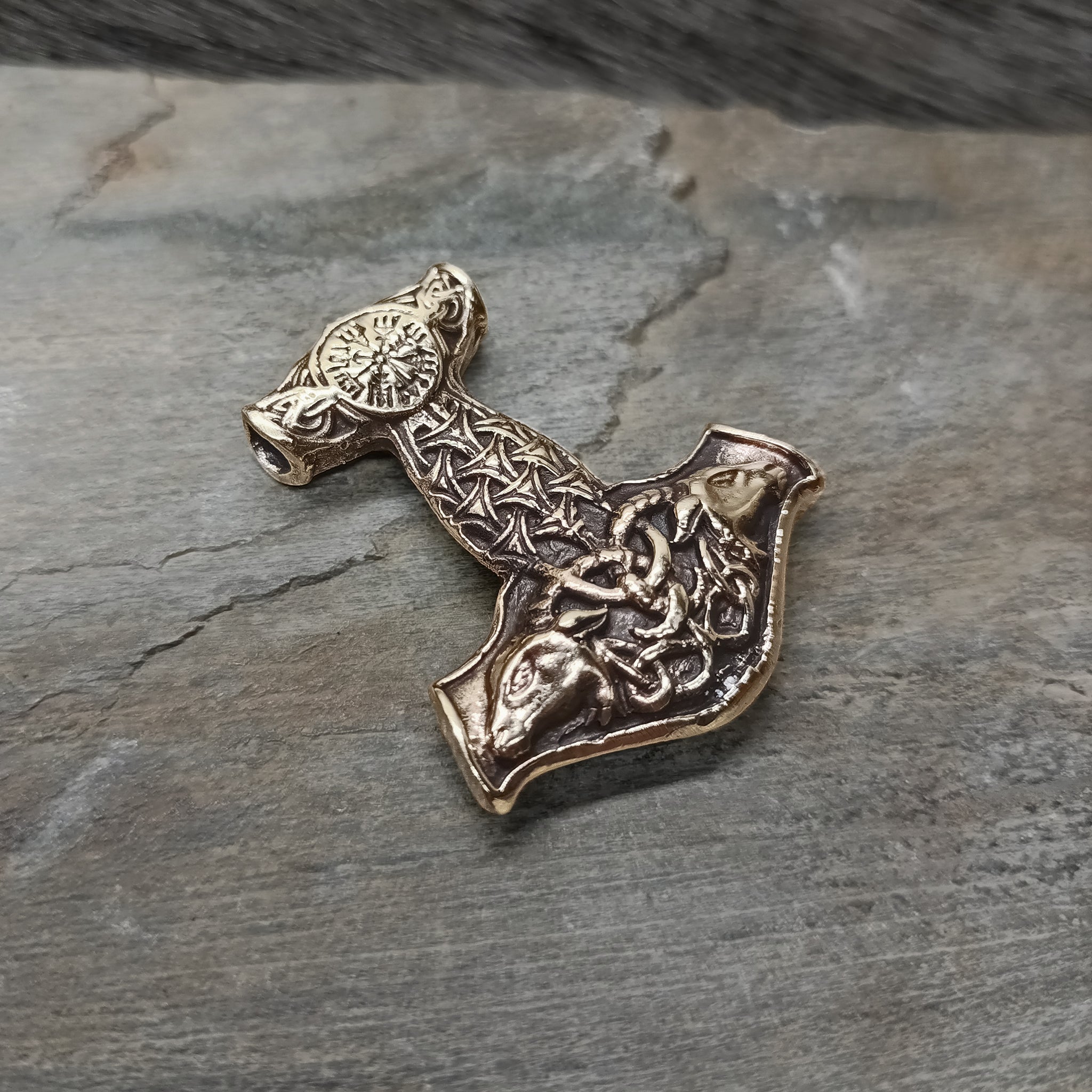 Bronze Goat Thors Hammer Pendant on Rock - Angle View