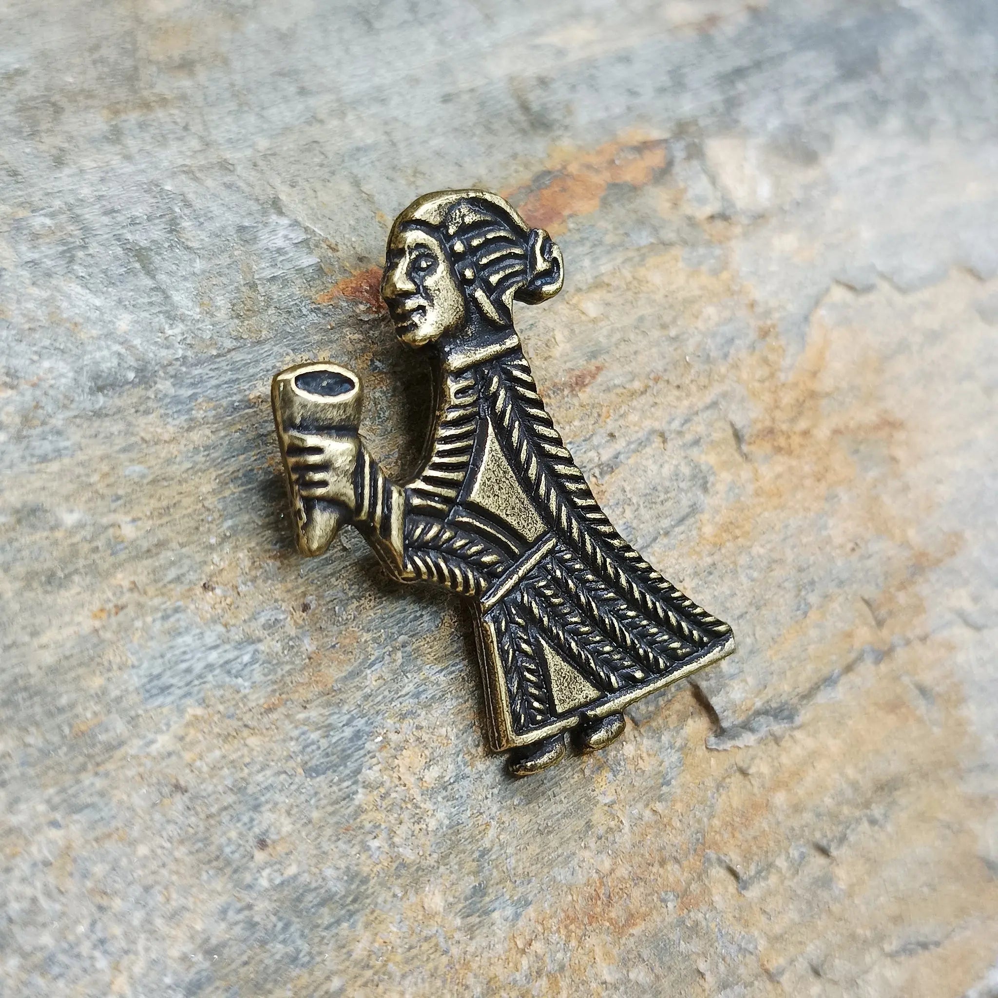 Bronze Valkyrie Pendant on Rock - Side View