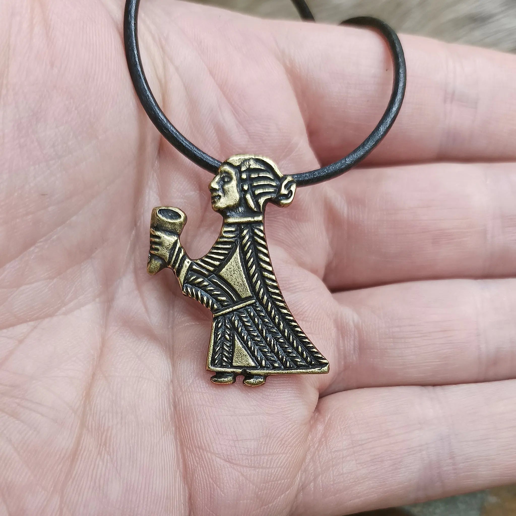 Bronze Valkyrie Pendant on Hand with Black Leather Thong