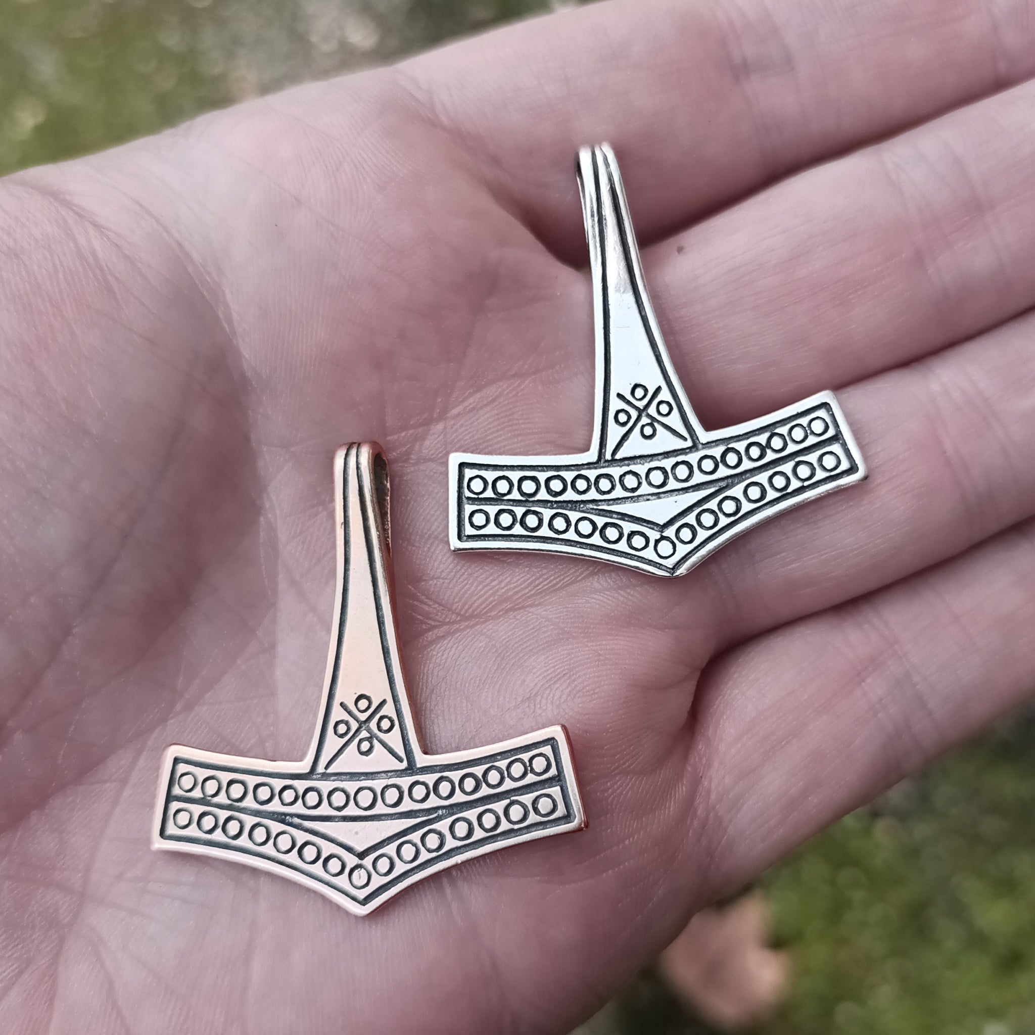 Large Rømersdal Replica Thors Hammer Pendants on Hand - Bronze and Silver