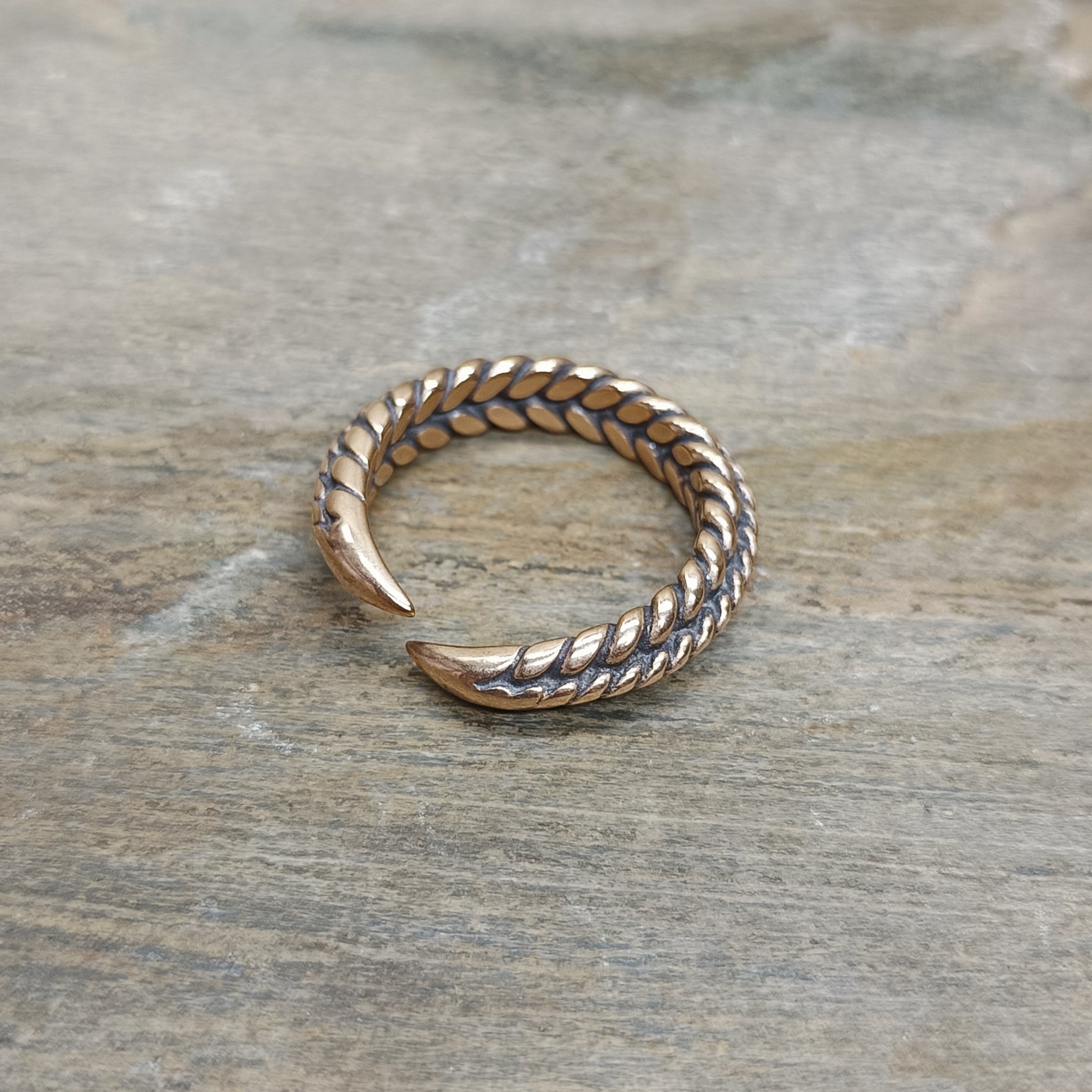 Bronze Braided Viking Ring on Stone - Back Angle View