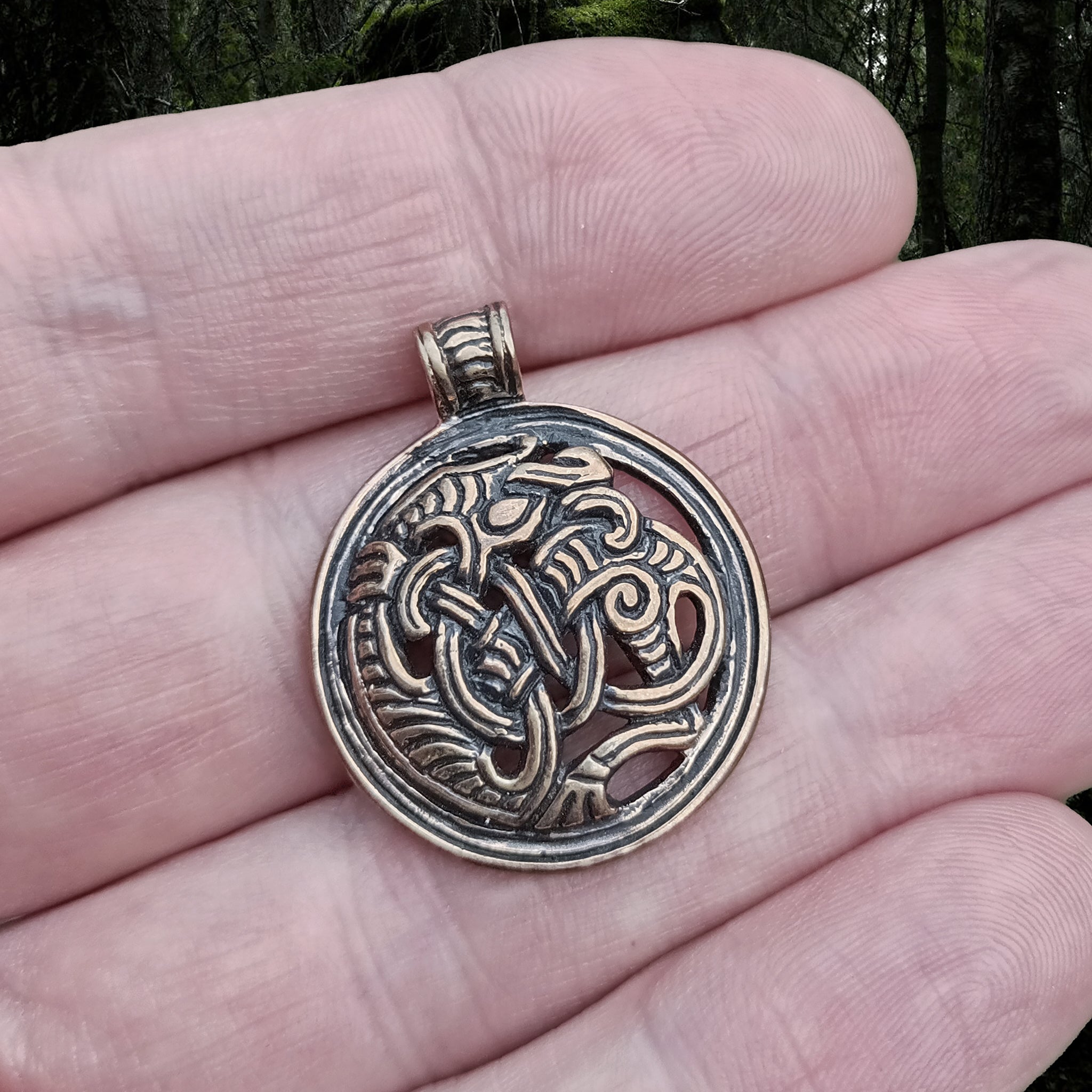 Round Dragon Beast Pendant in Bronze on Hand - Viking Jewelry from The Viking Dragon