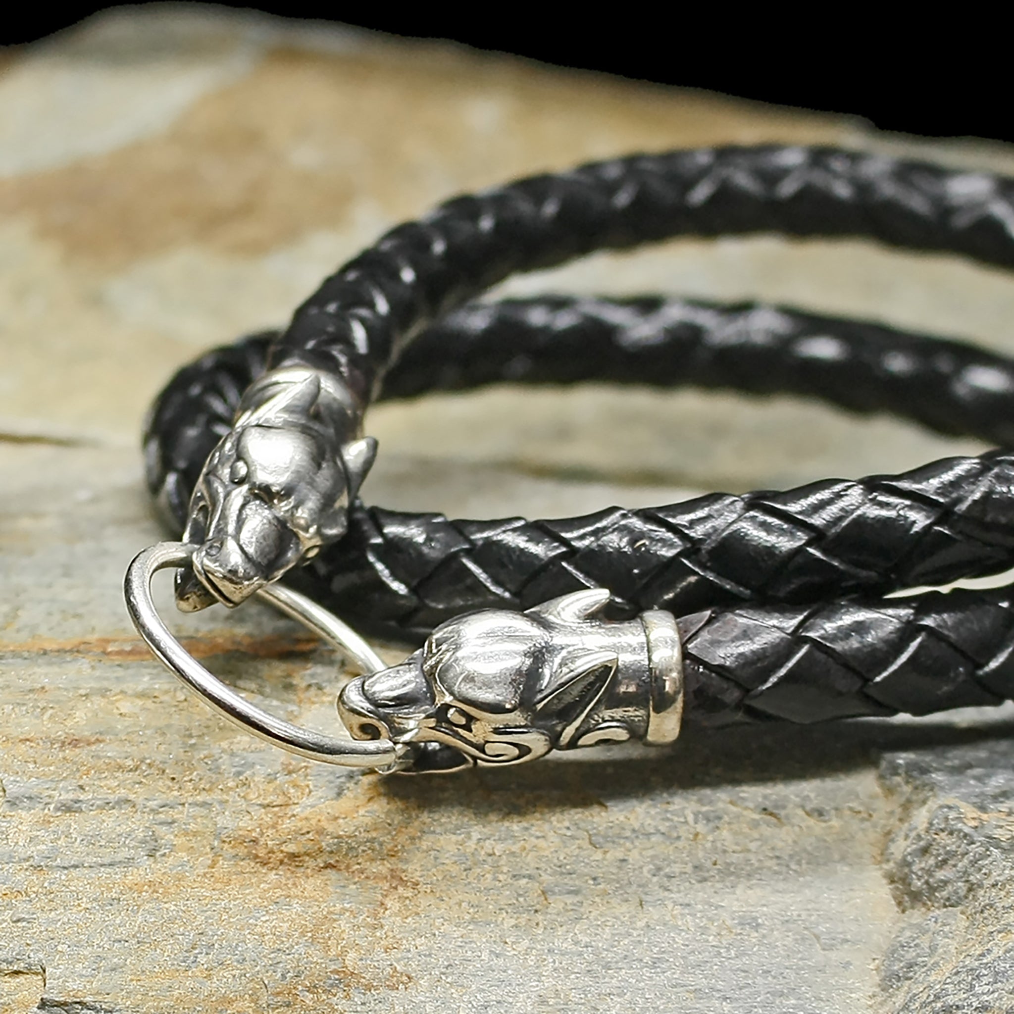 8mm Width Braided Leather Necklace with Silver Ferocious Wolf Heads & Split Ring on Rock