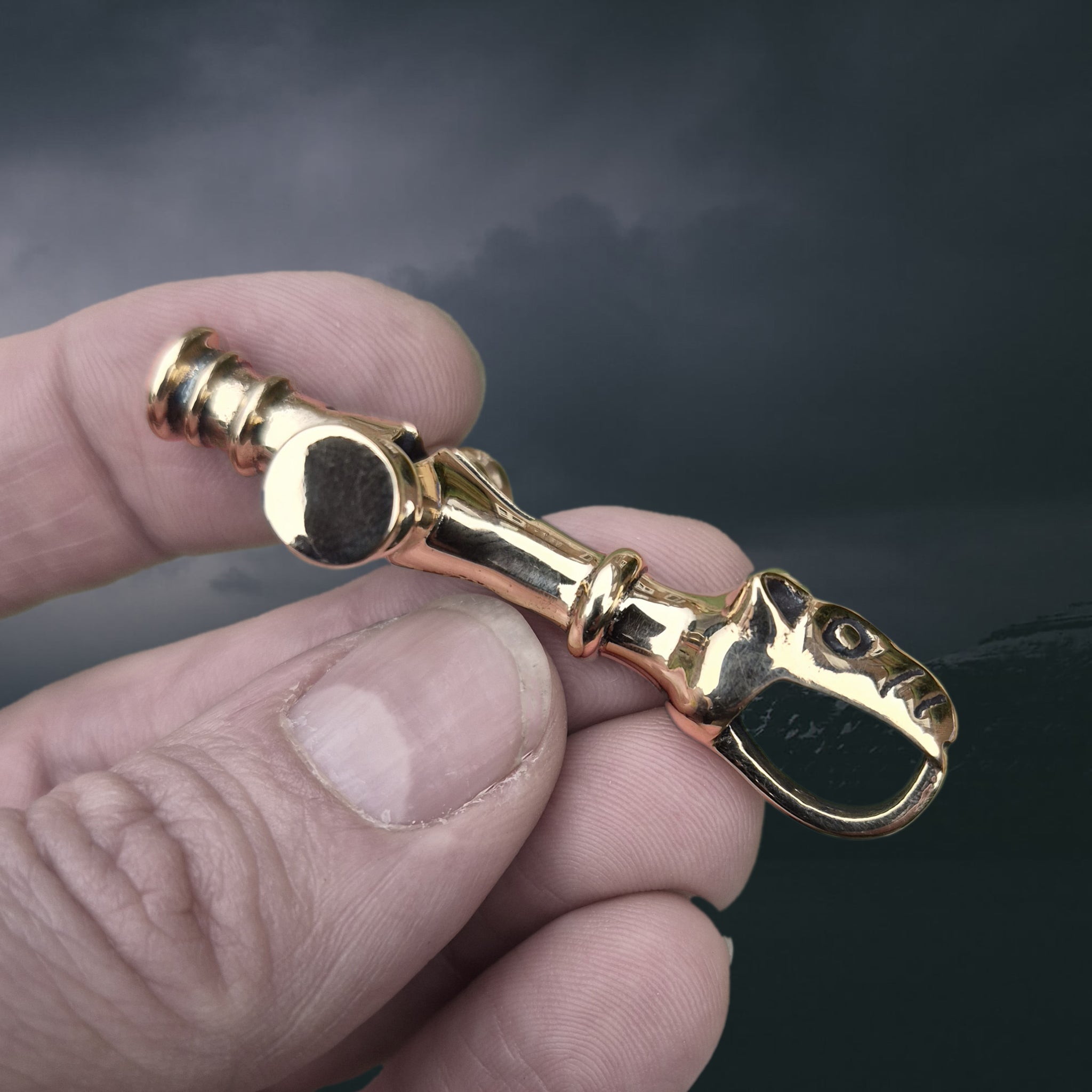 Large Bronze Icelandic Wolf Thor's Hammer Pendant Replica in Fingers - Side View