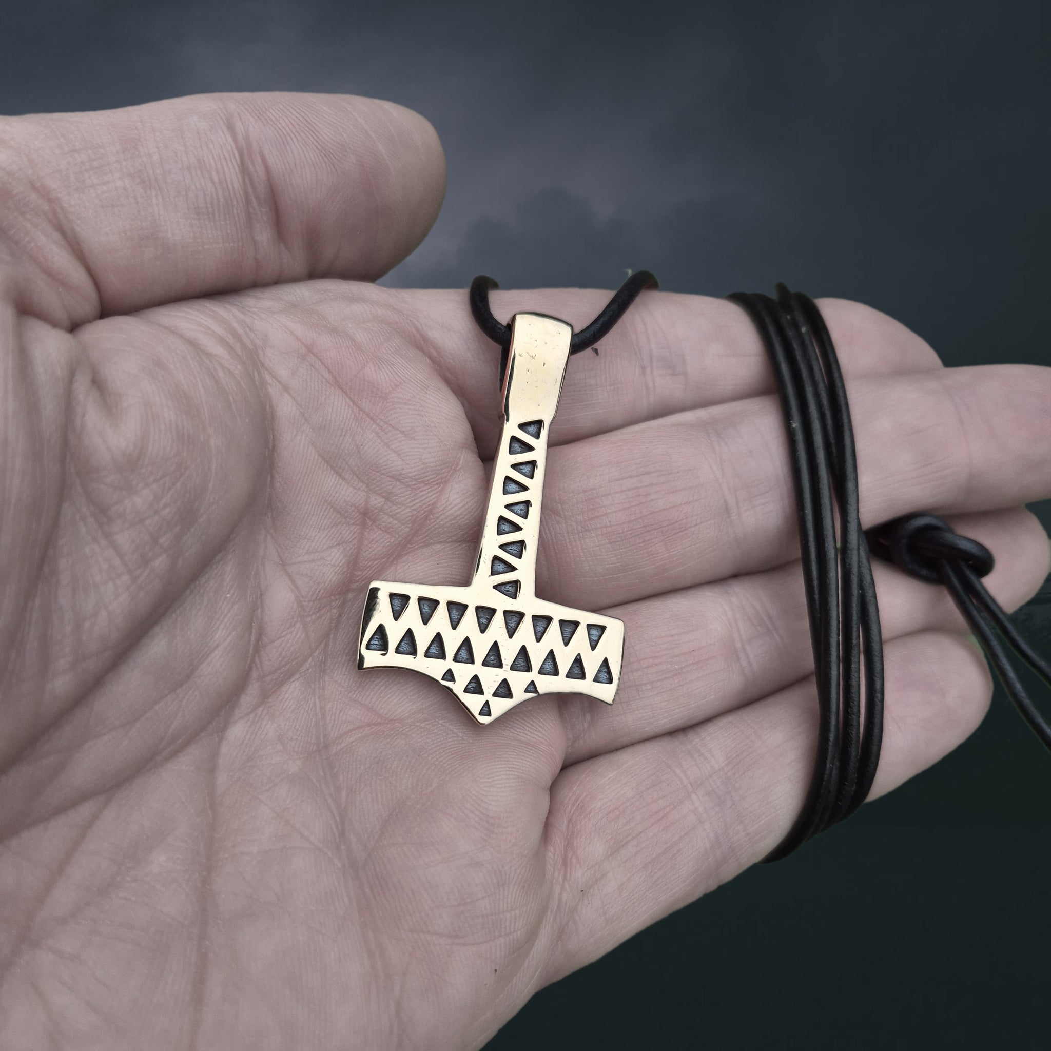 Bronze Thors Hammer Pendant Replica from Vålse, Denmark on Leather Cord, on Hand