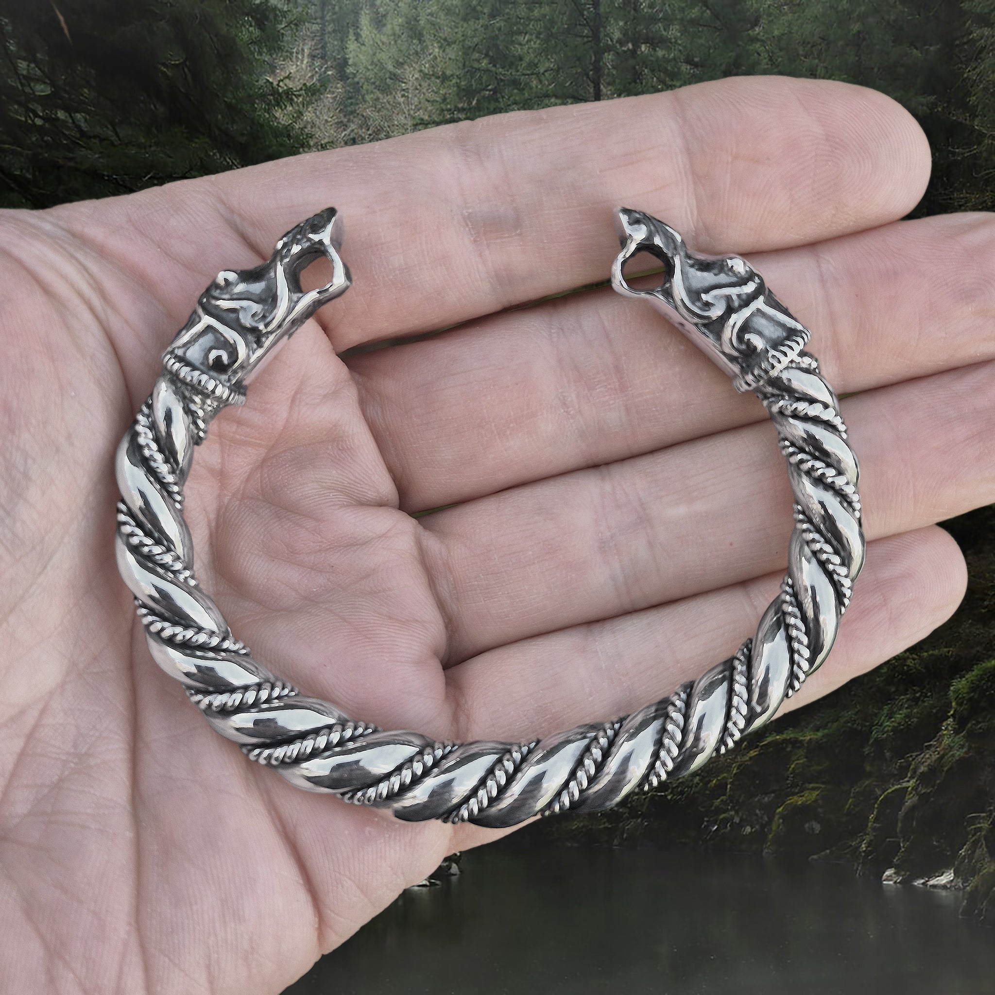 Thick Twisted Silver Arm Ring With Gotlandic Dragon Heads on Hand