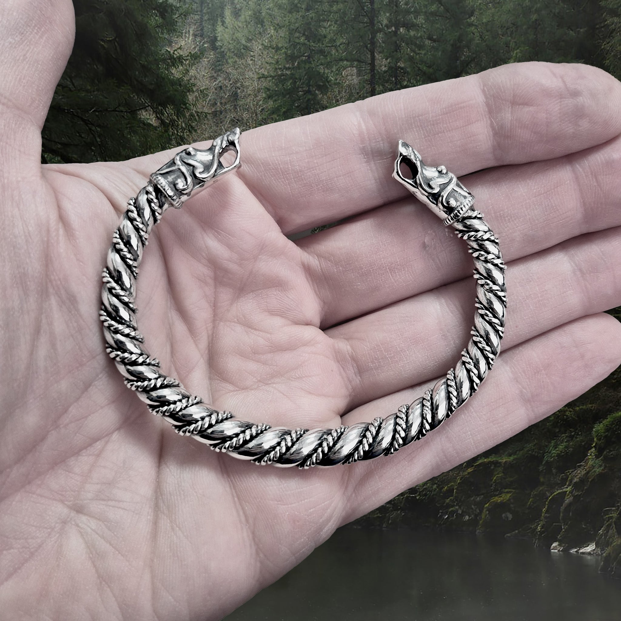 Twisted Silver Arm Ring / Bracelet With Gotlandic Dragon Heads on Hand
