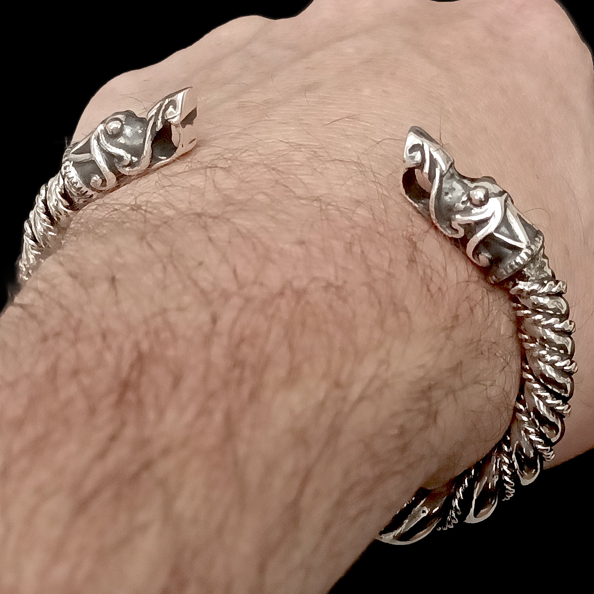 Thick Twisted Silver Arm Ring With Gotlandic Dragon Heads on Wrist