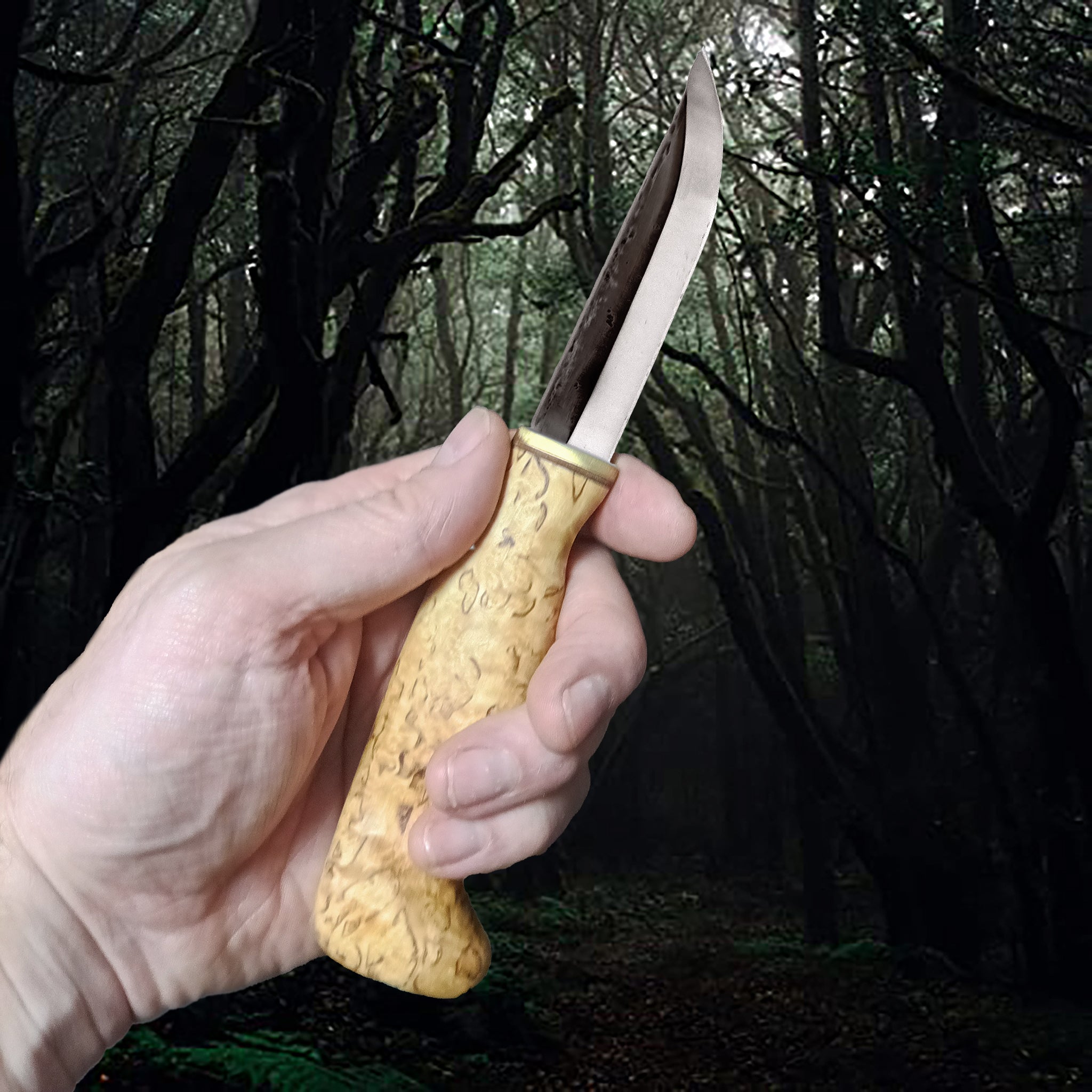 Finnish Puukko Hunting Knife with Curly Birch Handle in Hand - Other Side