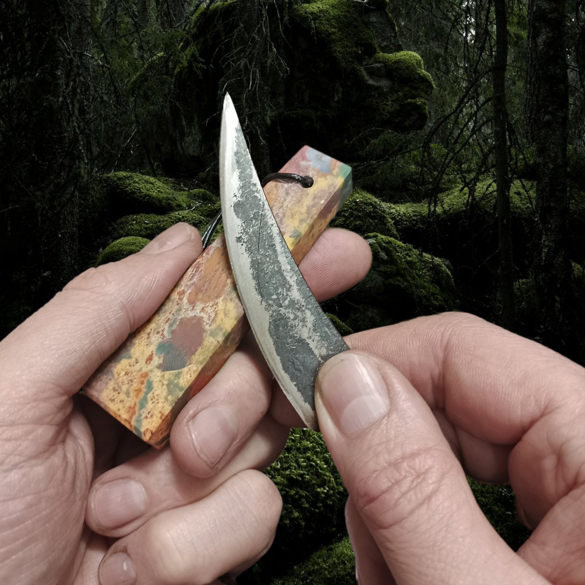 Banded Jasper Viking Whetstone sharpening an Iron Age Viking Knife