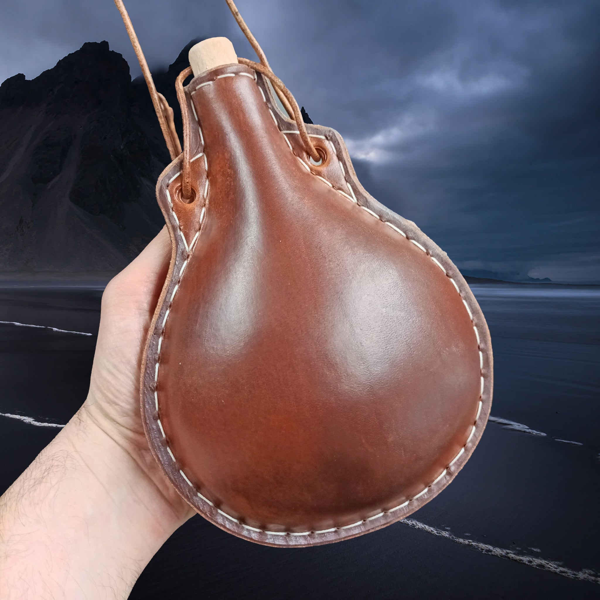 Handmade Thick Boiled Leather Water Bottle with Wood Stopper & Leather Thong Strap in Hand