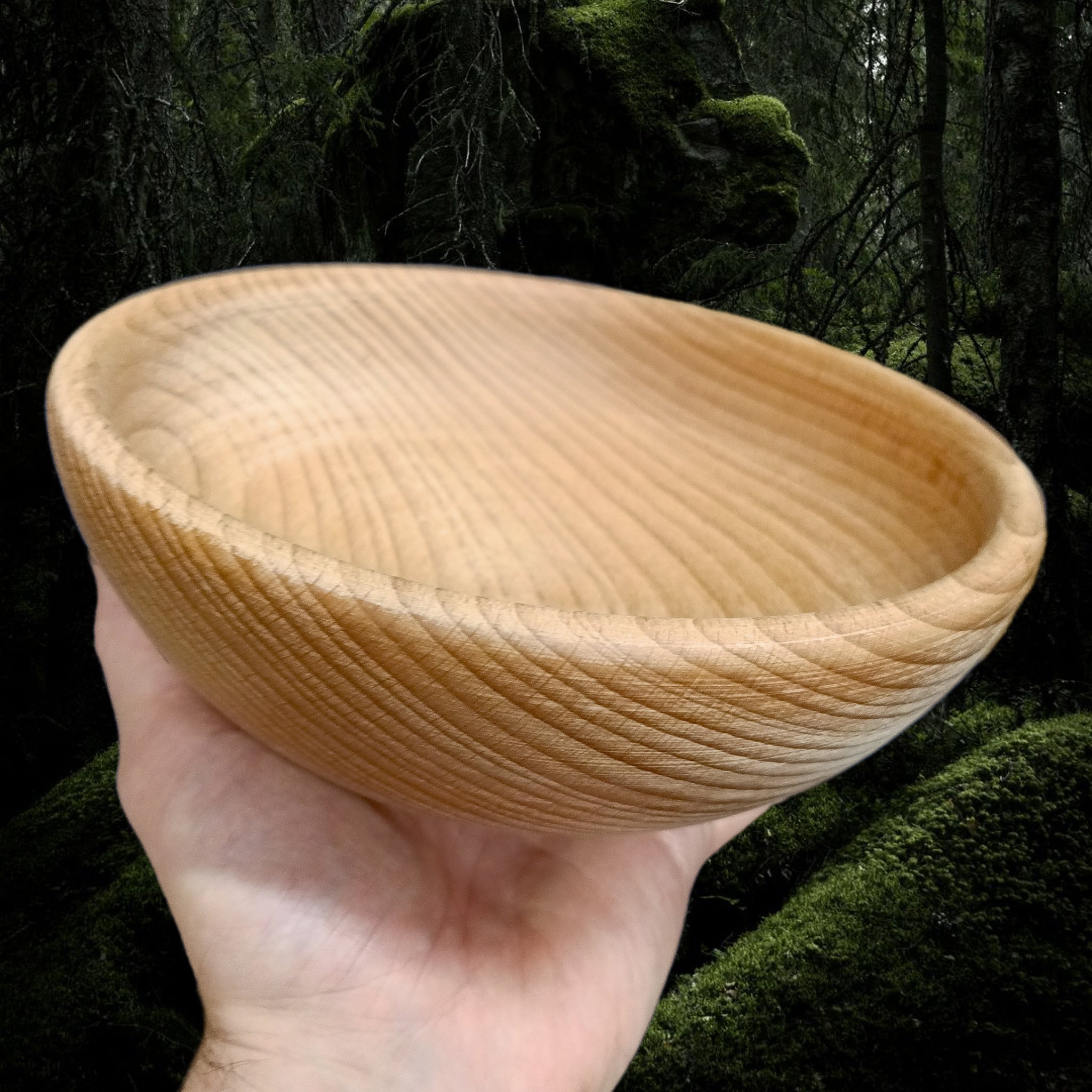 Large, Hand-Turned Medieval Wooden Bowl in Hand - Side View