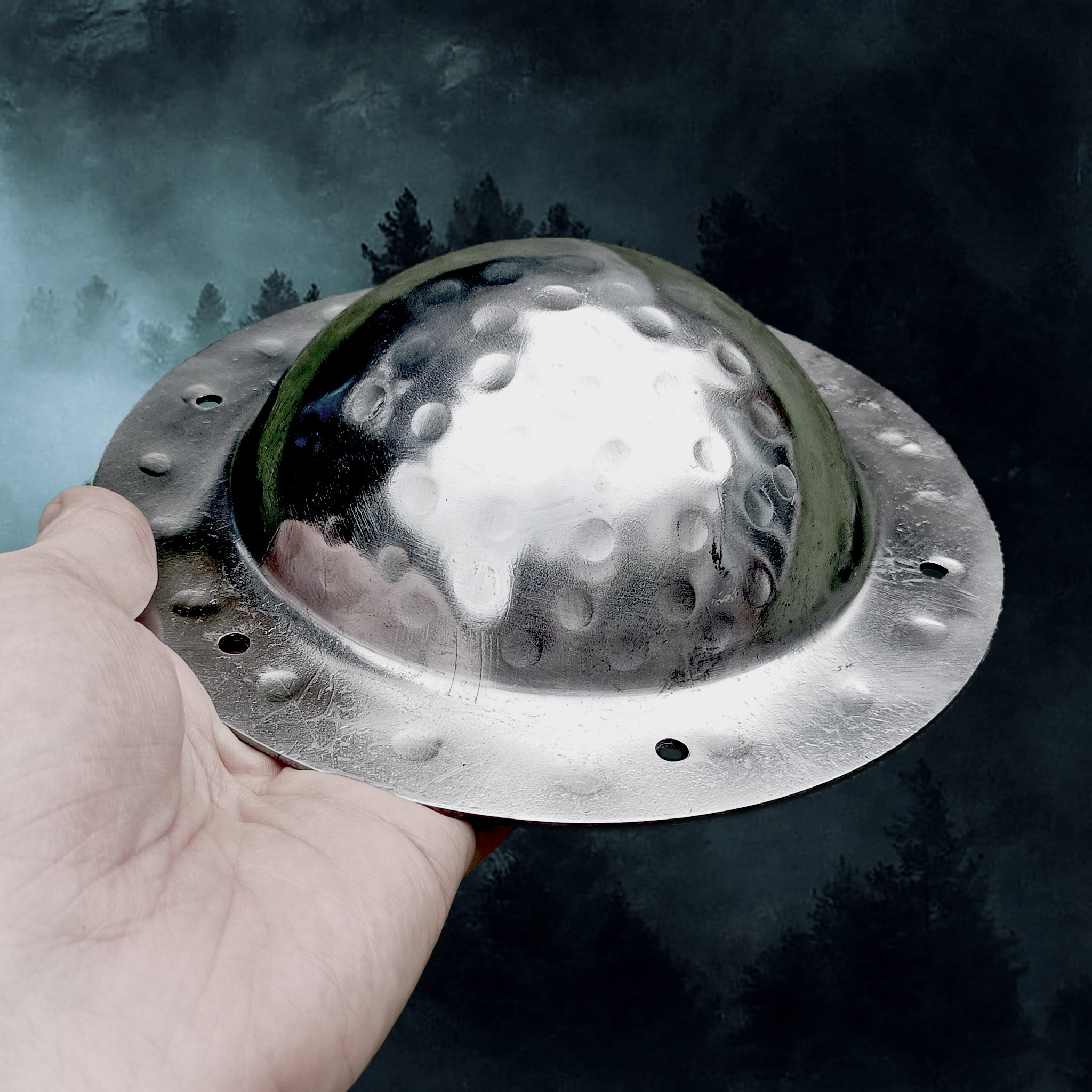 Polished Domed Viking Shield Boss with Rivet Holes in Hand - Angle View