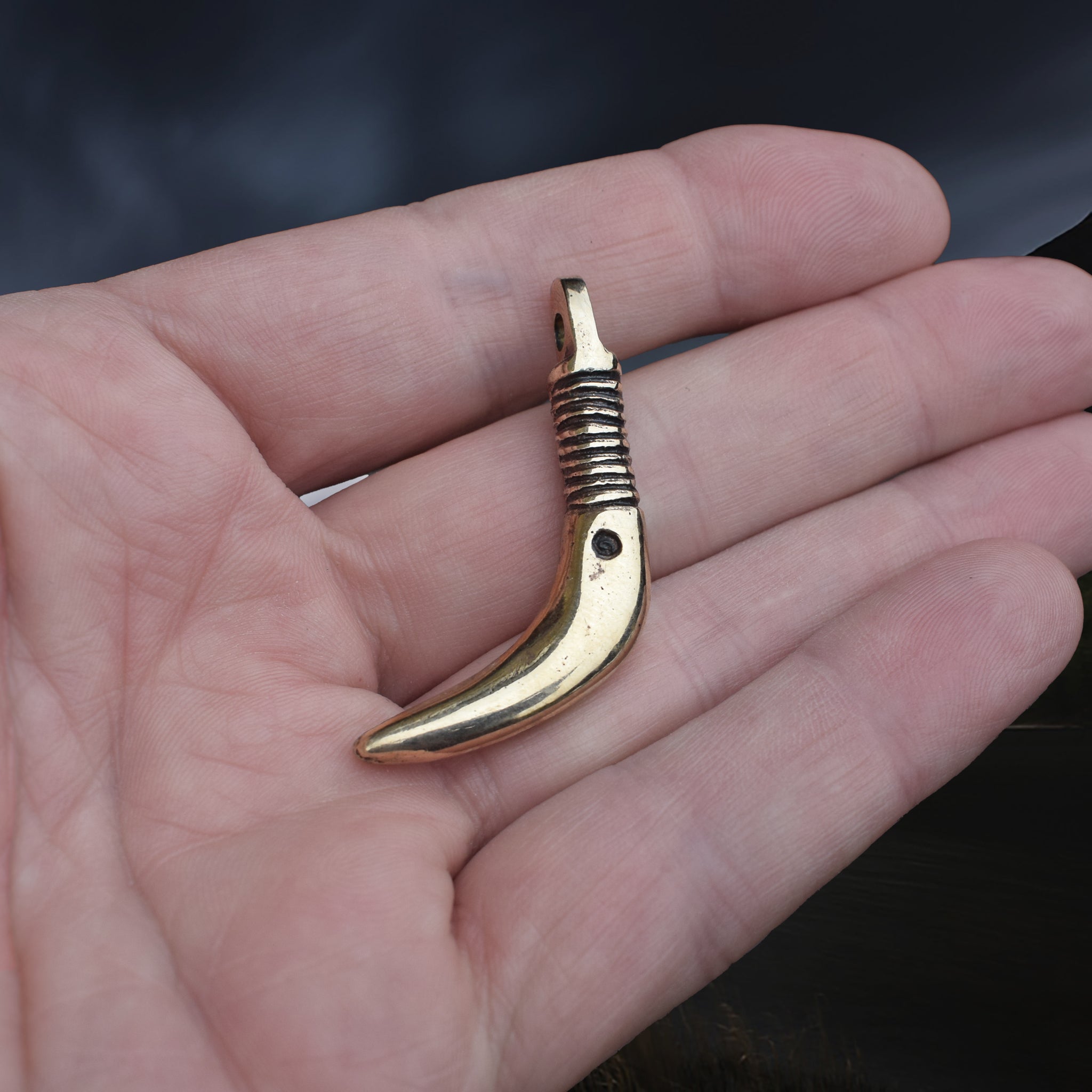Solid Bronze Replica Viking Bear Tooth Pendant from 9th to 11th century Finland  on Hand