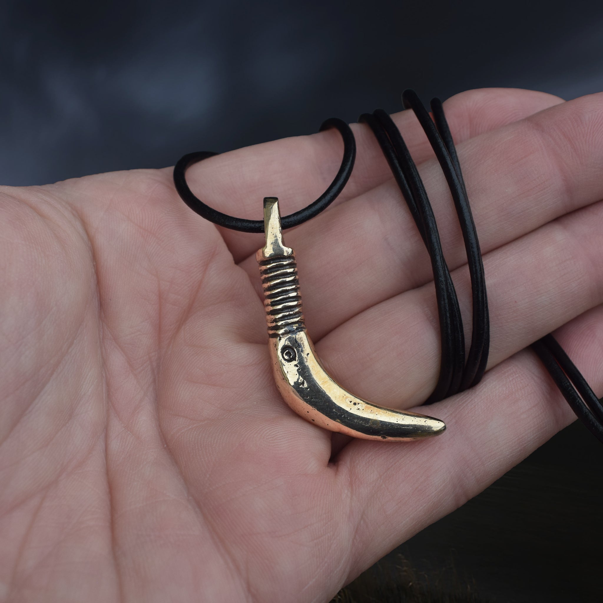 Solid Bronze Replica Viking Bear Tooth Pendant from 9th to 11th century Finland on Wrapped Leather Cord, on Hand