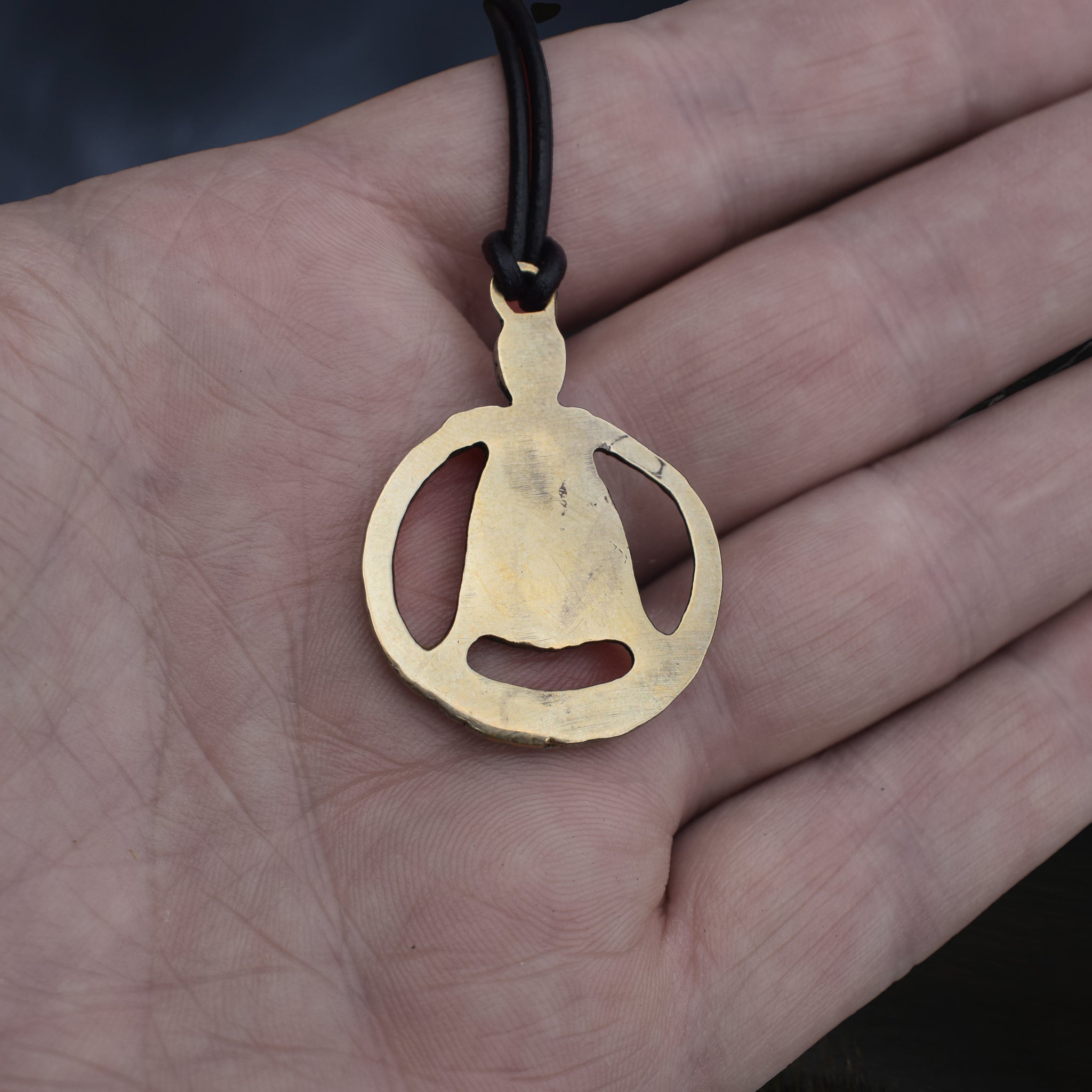 Large Bronze Circular Freya Pendant Replica with Top Loop on Leather Cord, on Hand - Back View
