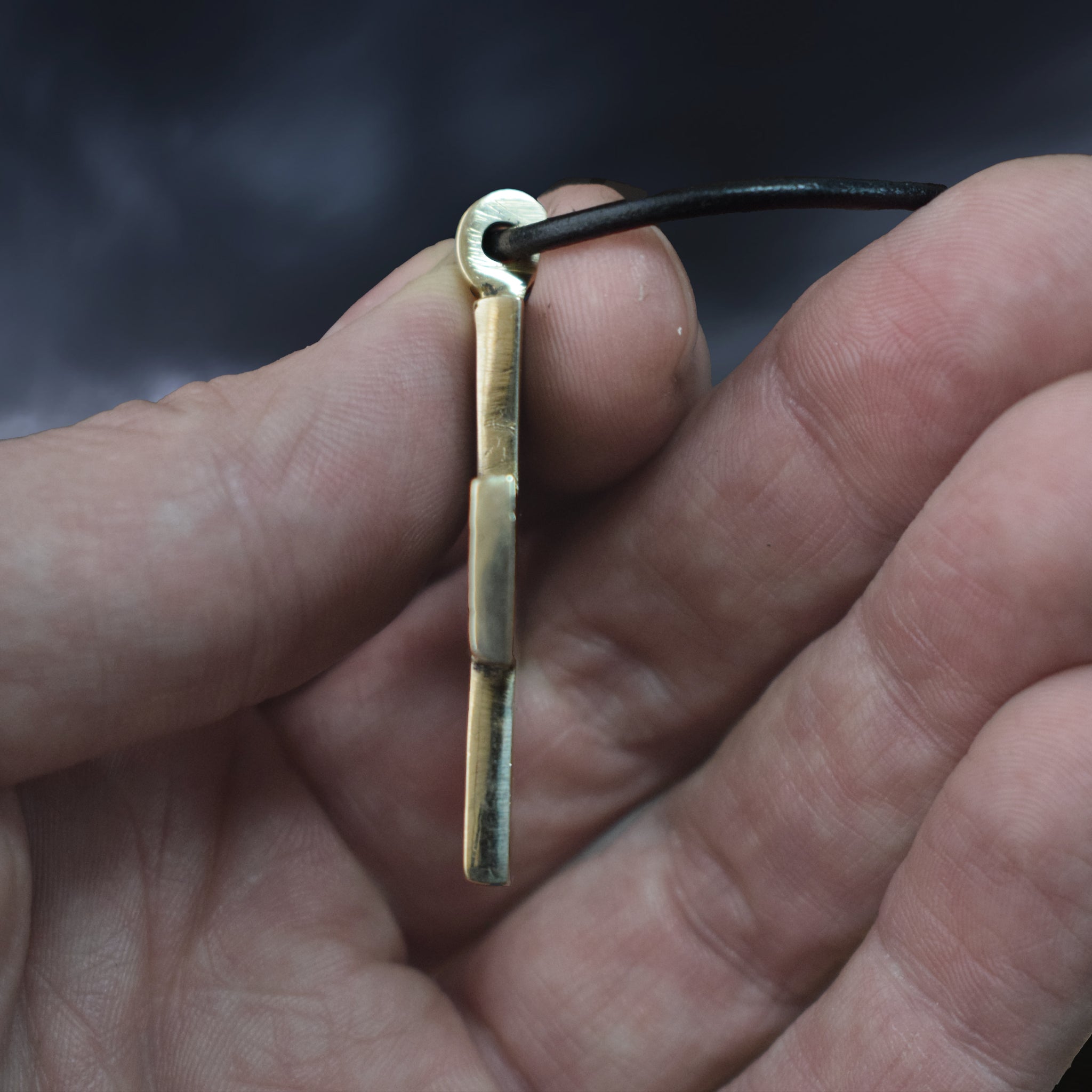 Bronze Replica Germanic Cross / Crucifix Pendant in Fingers - Side View