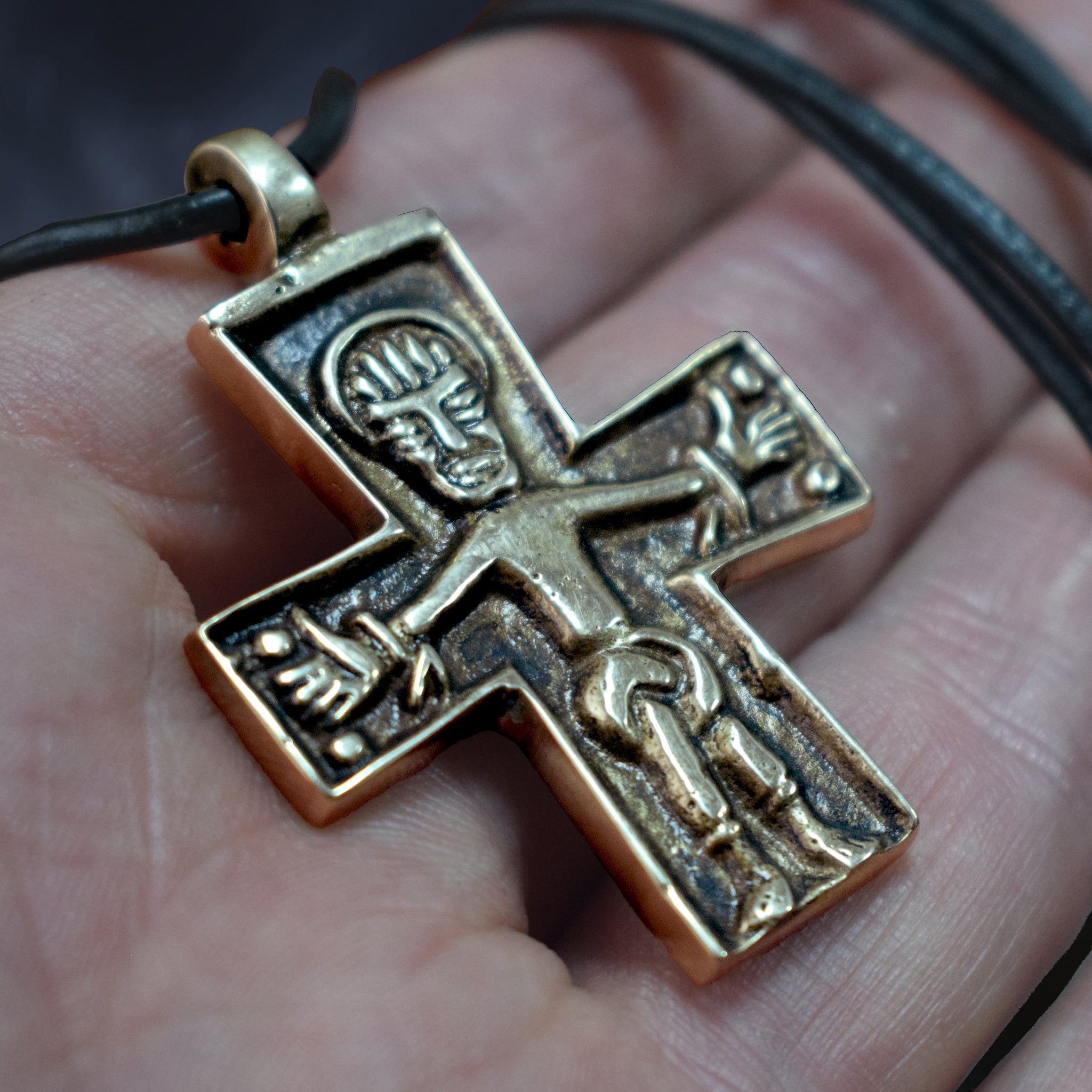 Bronze Replica Germanic Cross / Crucifix Pendant on Leather Cord -  On Hand - Close Up Angle View