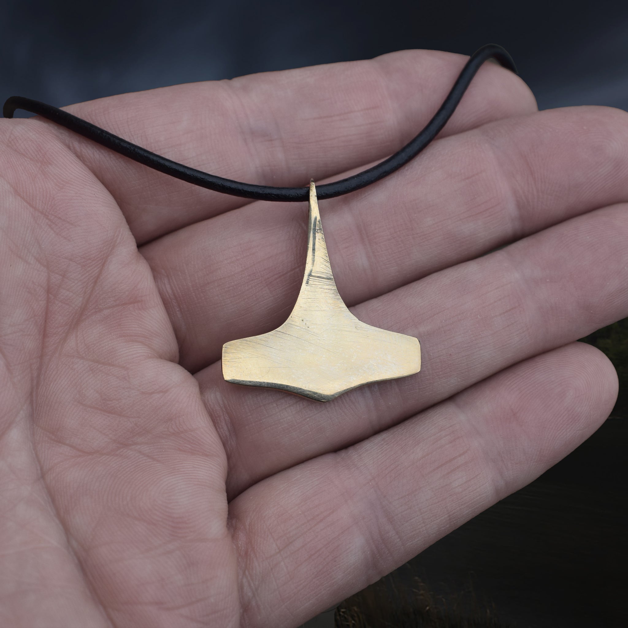 Bronze Replica Thors Hammer Pendant from 10th Century Denmark with Dot & Ring Design on Leather Cord, on Hand - Back View