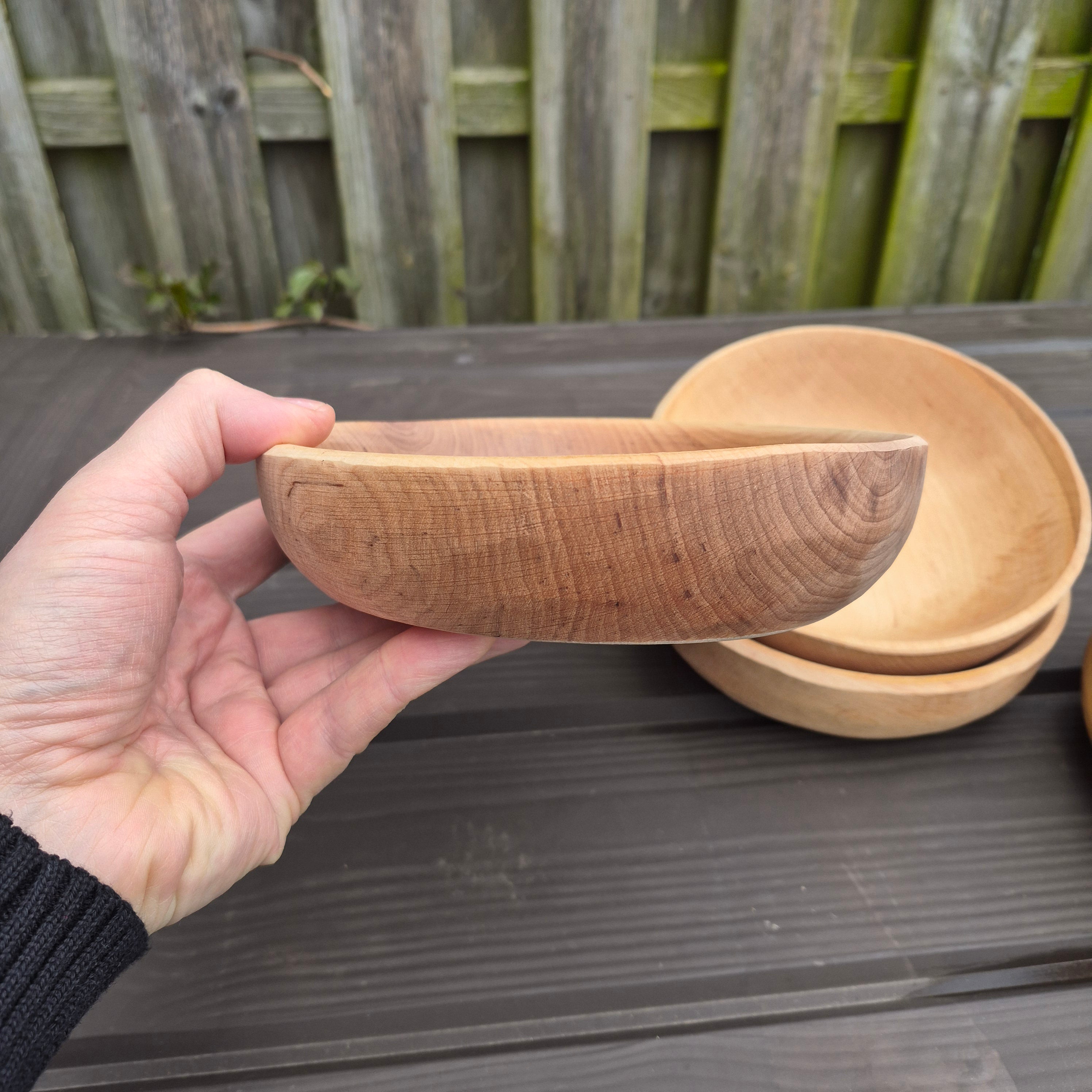 Viking Age Replica Hand Turned Alder Wood Bowl in Hand - Side View from The Viking Dragon