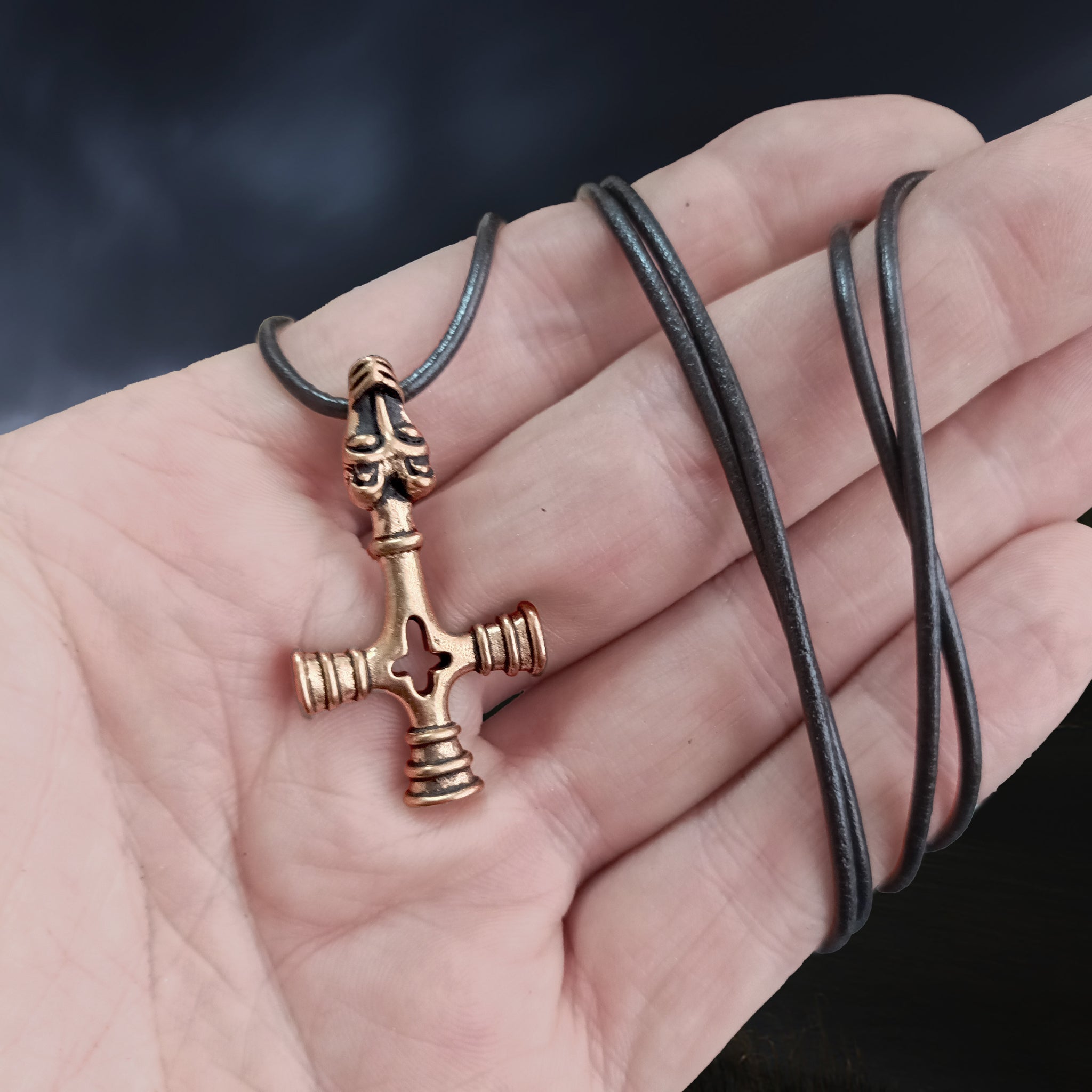Bronze Wolf Cross Thors Hammer Pendant on Hand  with Black Leather Cord