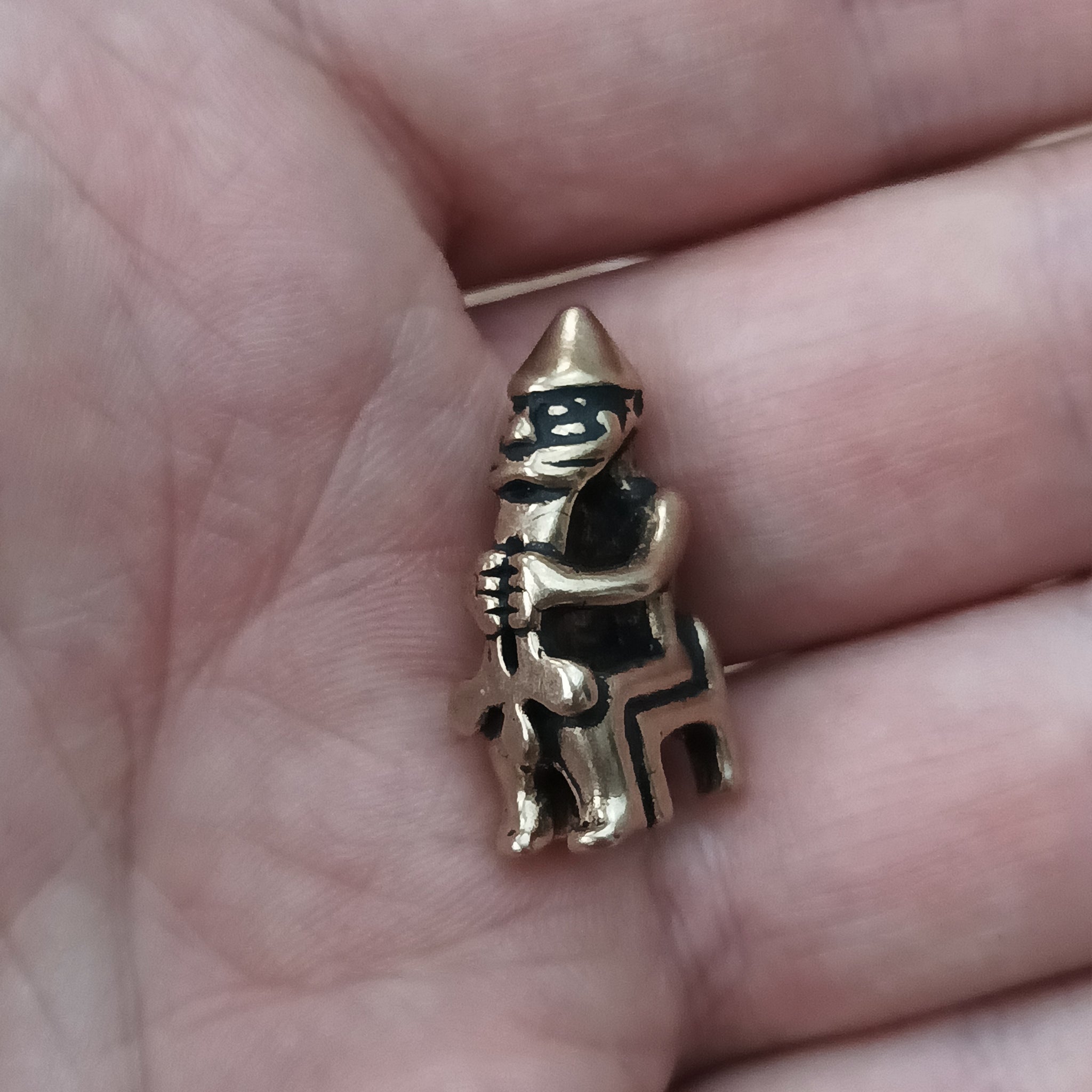 Bronze Seated Thor Pendant in Hand - Side Angle View