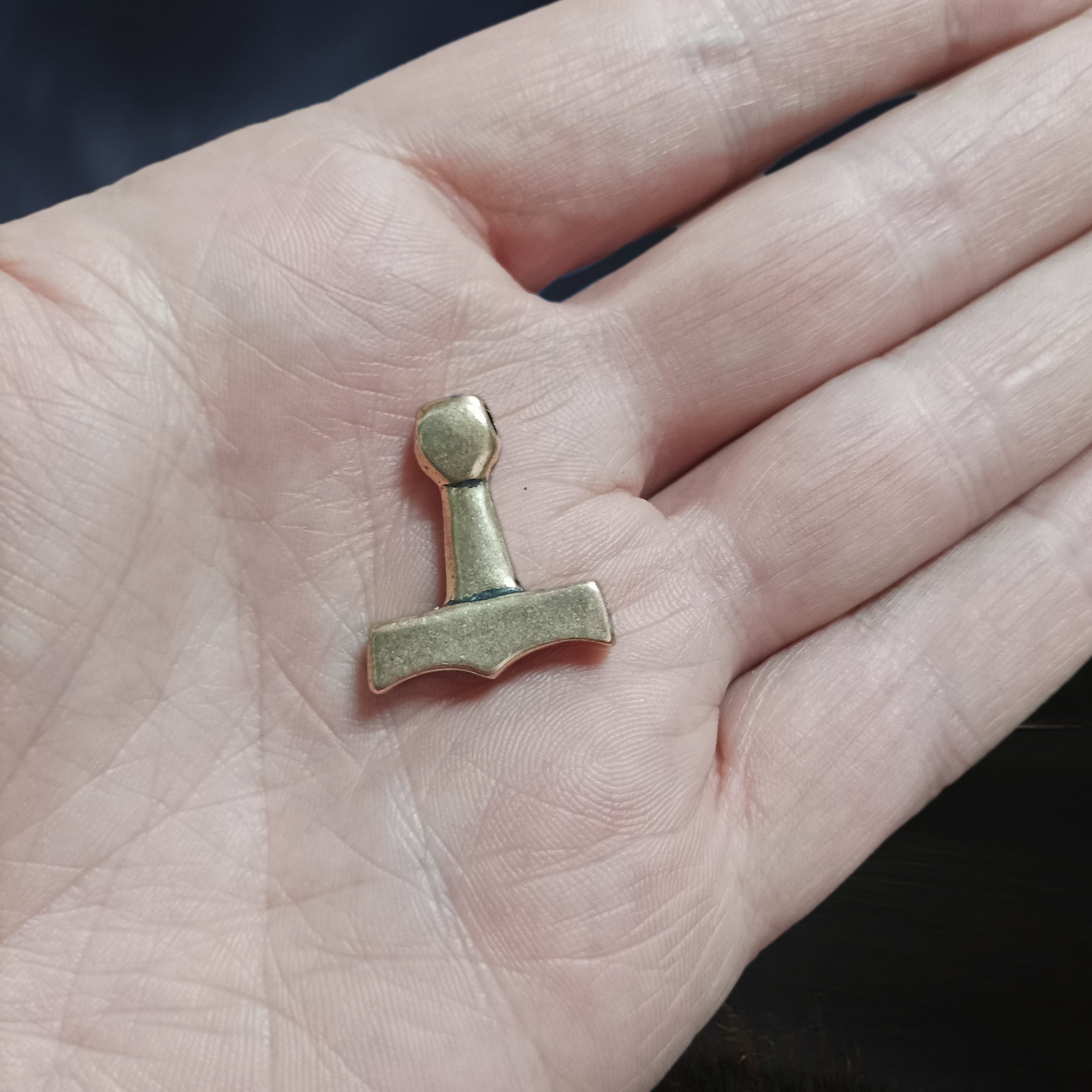 Small Bronze Replica Viking Thor's Hammer Pendant from the Island of Sejerø, Denmark on hand