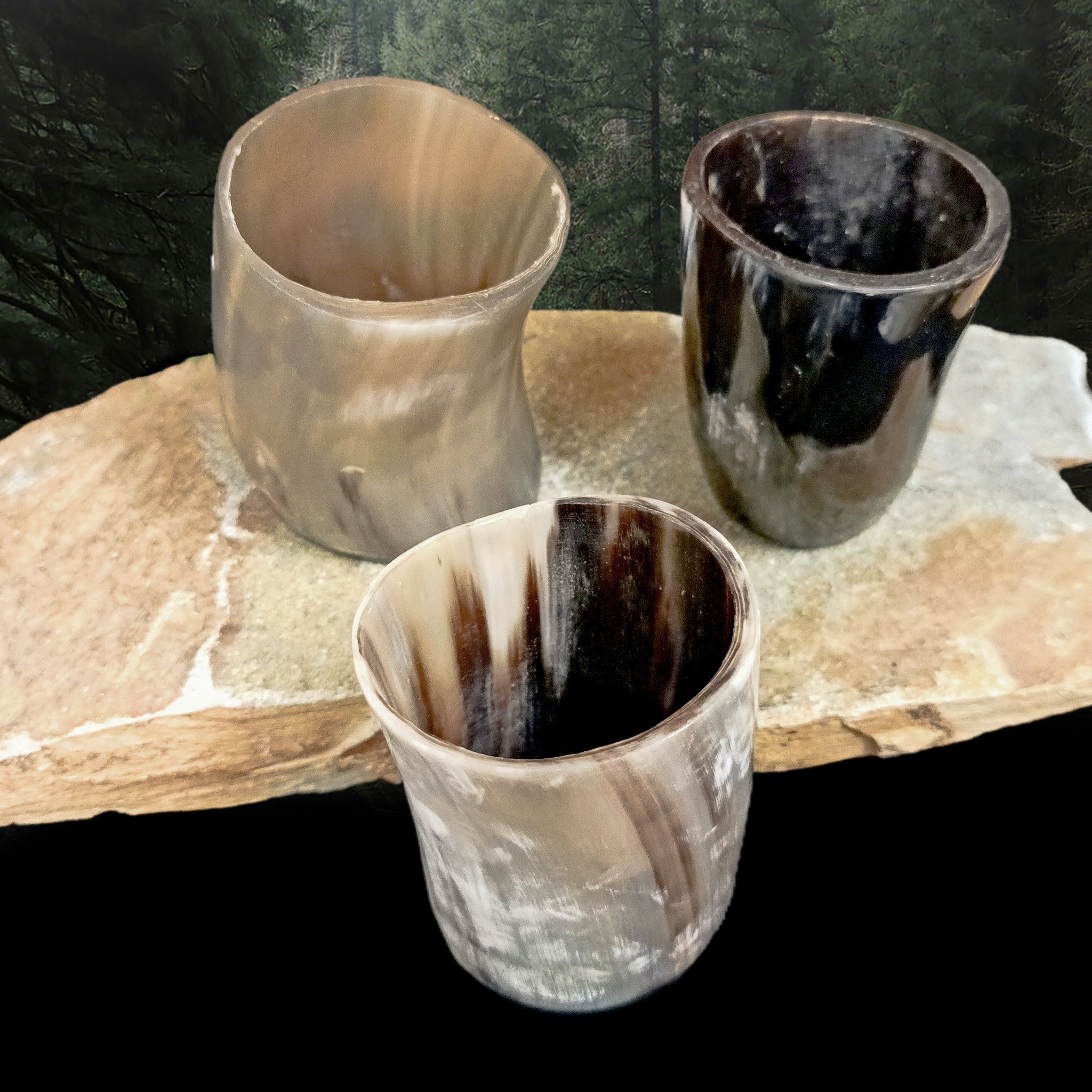 Handmade Cow Horn Dice Shakers / Shot Cups with Resin Base on Rock - Angle View