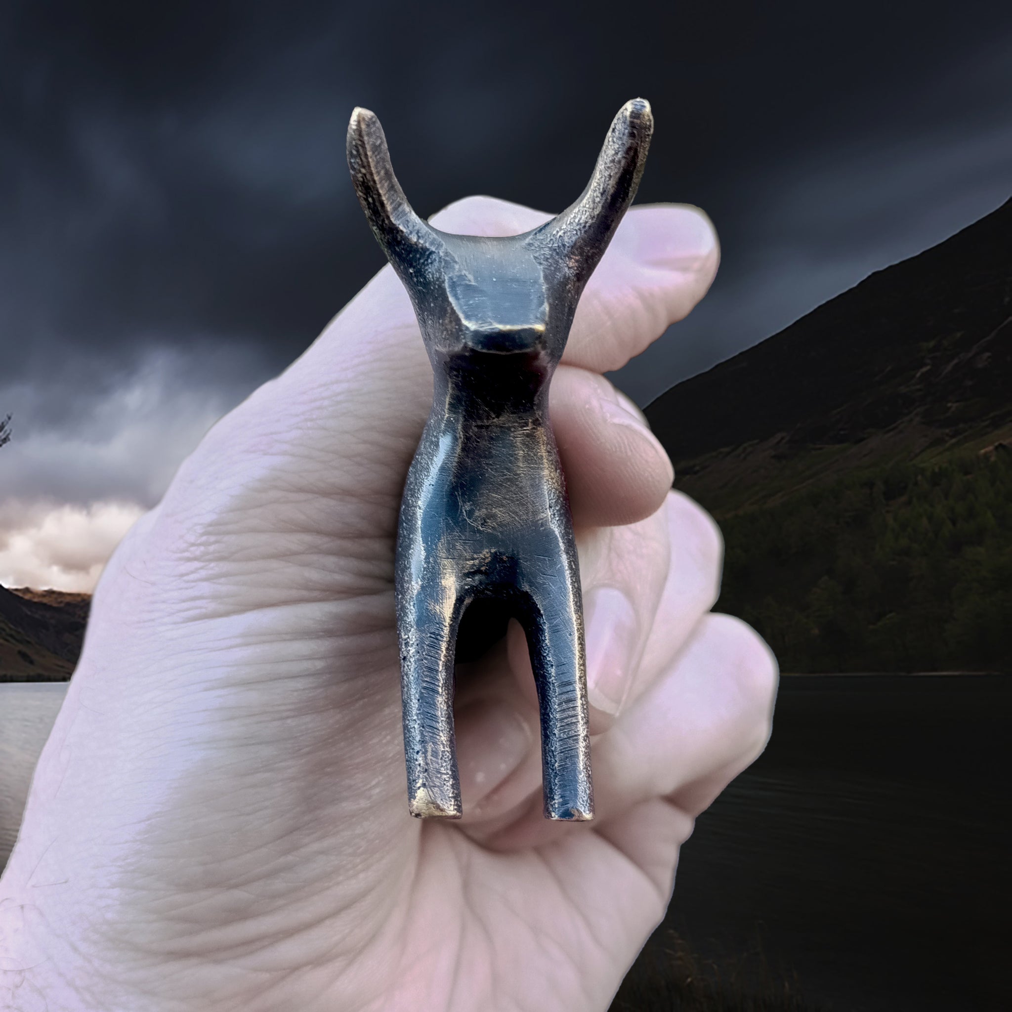 Bronze Age Scandinavian Bronze Bull Statuette in Fingers - Front View