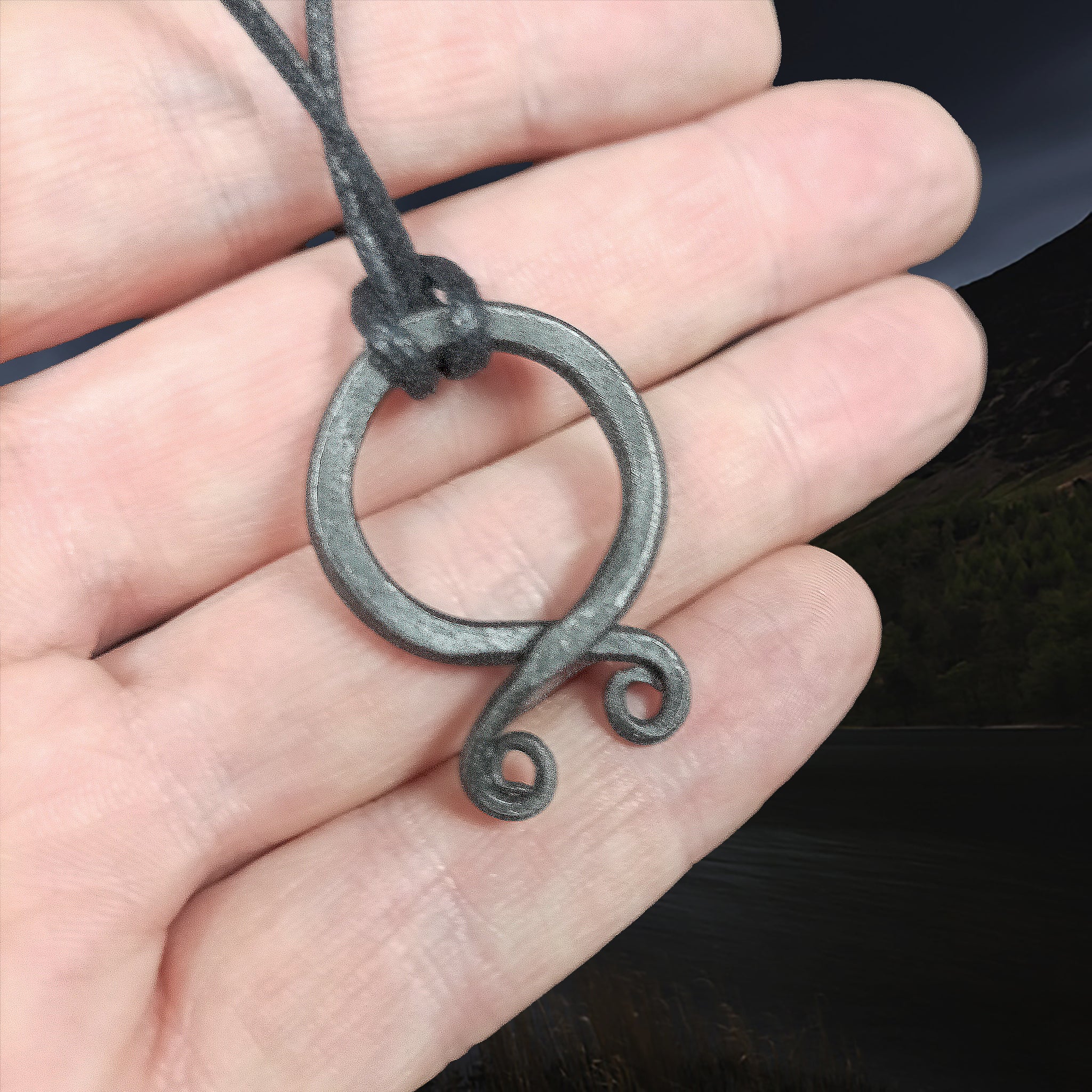 Hand-Forged Iron Odal Pendant on Leather Thong on Hand