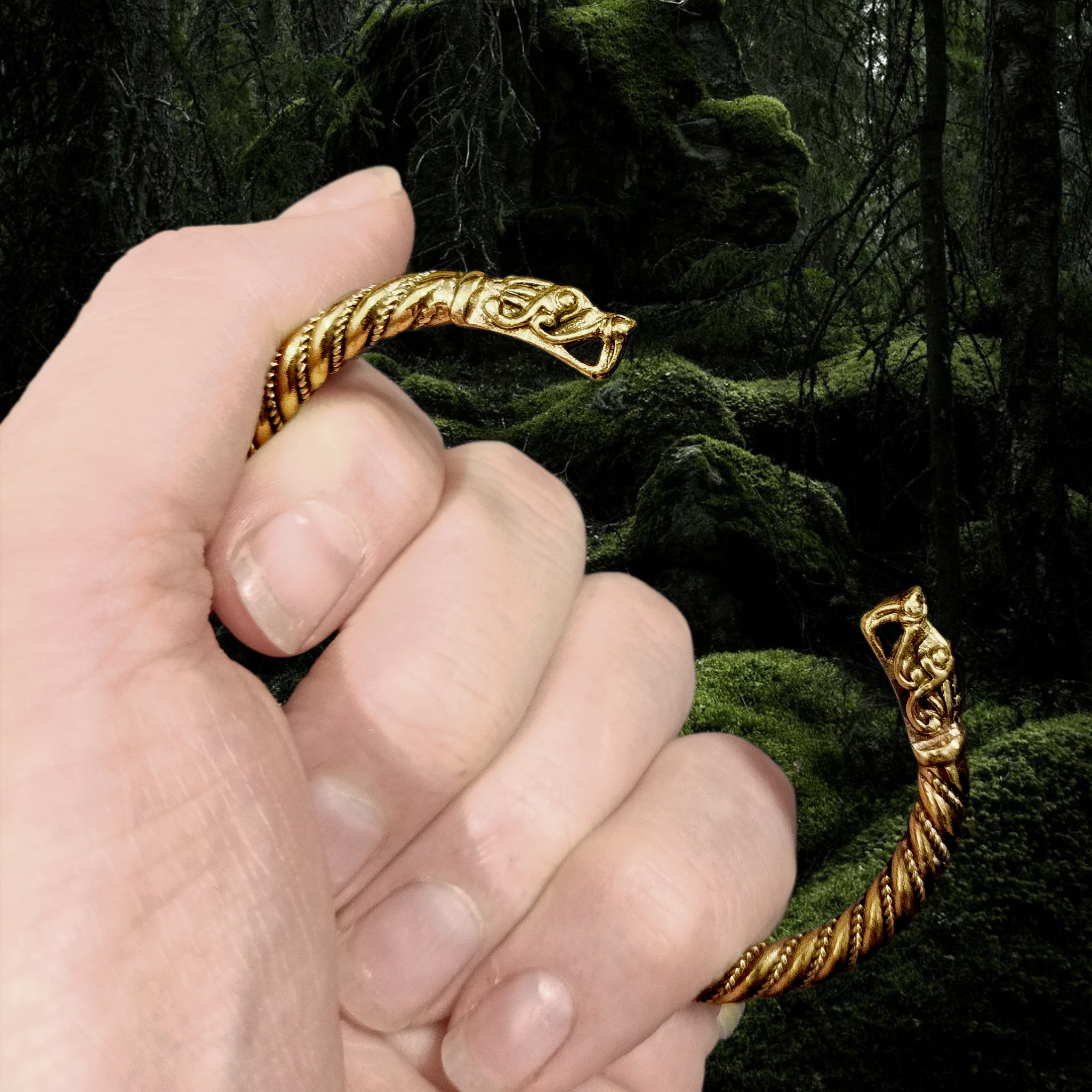 Handmade Twisted Bronze Bracelet With Gotlandic Dragon Heads in Hand