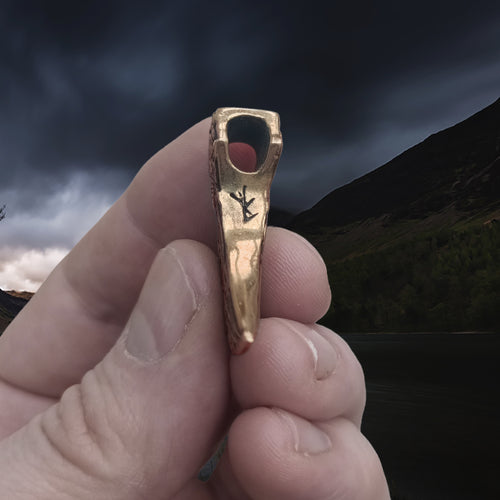 Bronze Knotwork Axe Head Pendant in Hand - Underside View