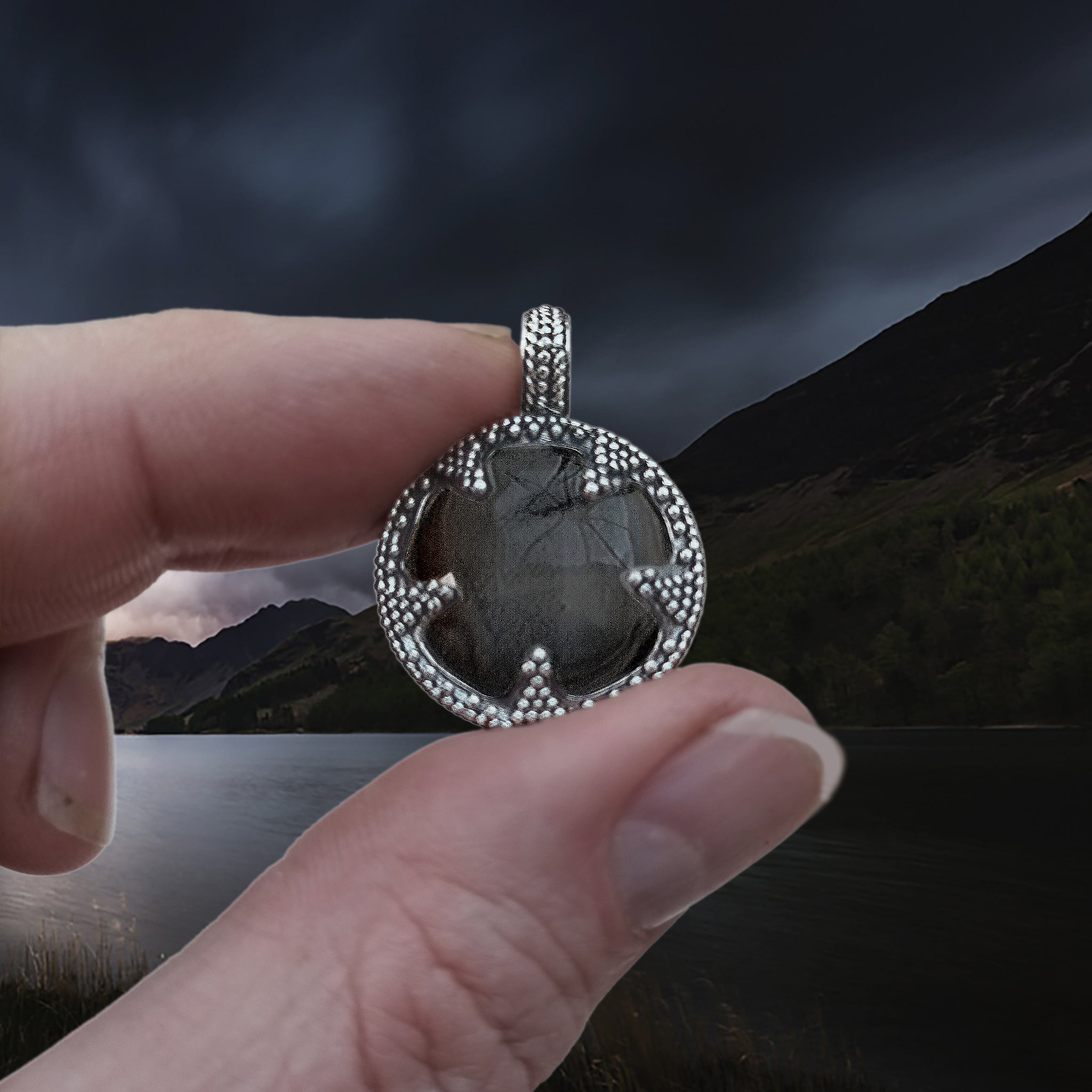 Medium Silver Gotland Crystal Lens Pendant in Finger and Thumb