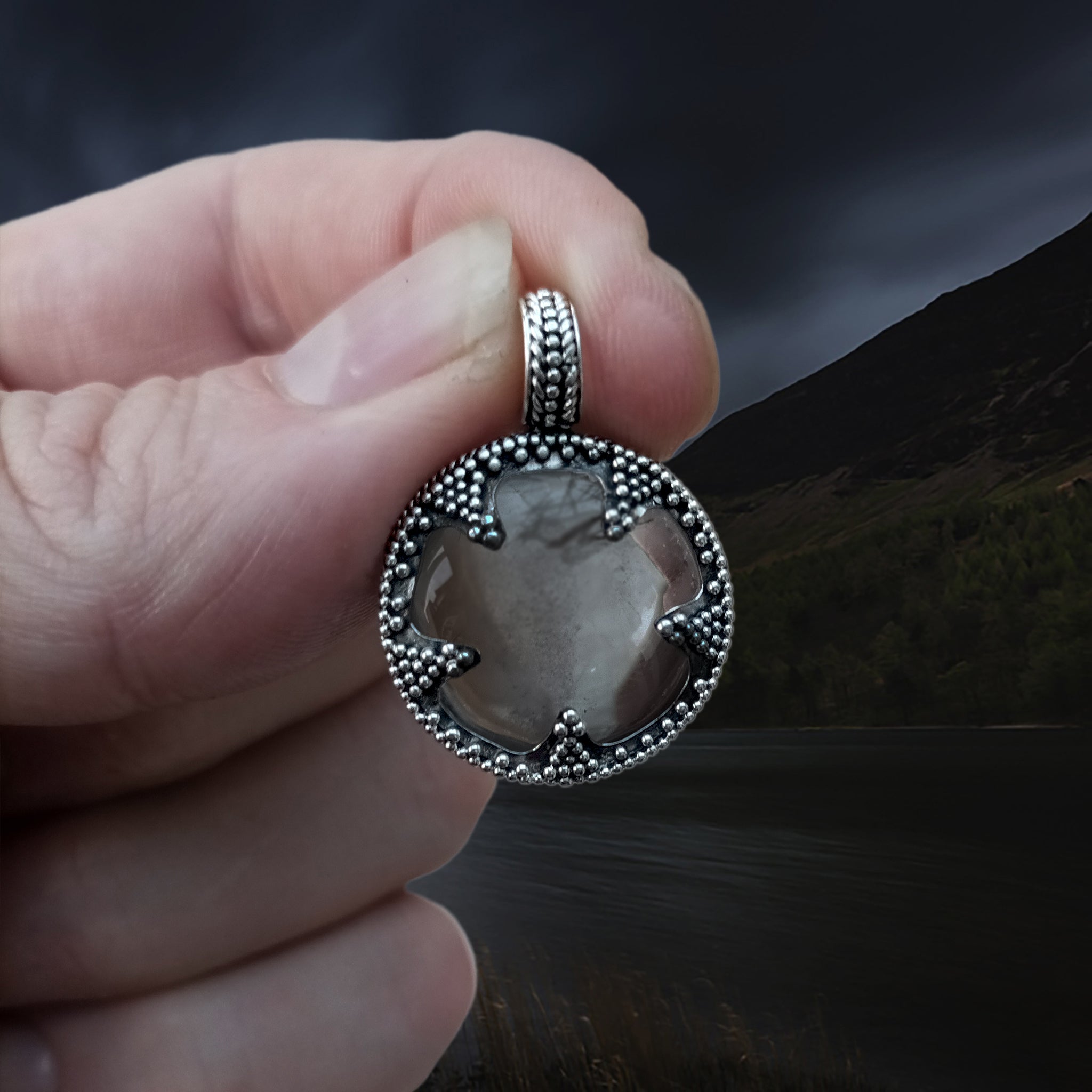 Medium Silver Gotland Crystal Lens Pendant in Fingers