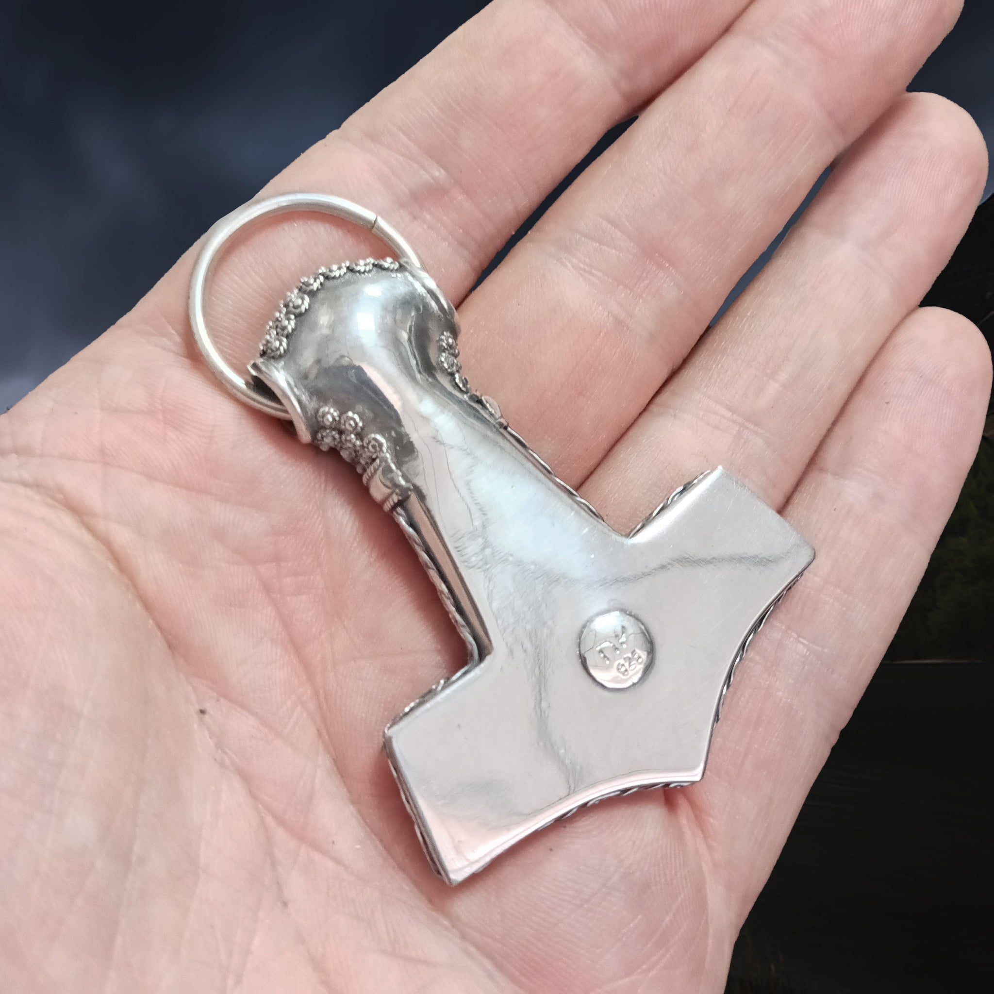 Large Silver Filigree Thors Hammer Pendant Replica from Öland on Hand - Back Angle View