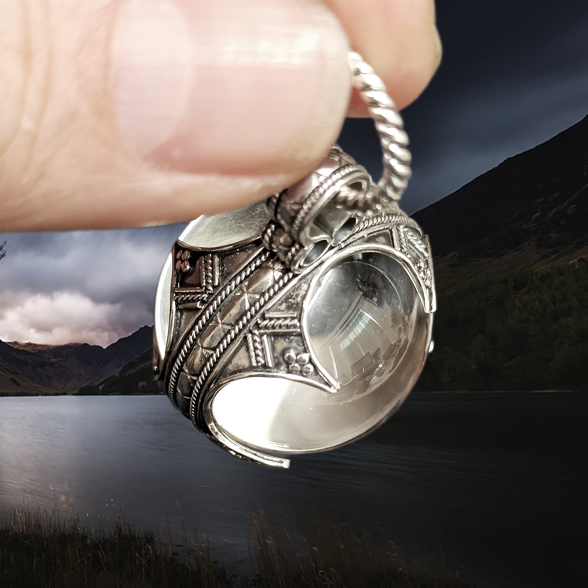 Large Silver Gotland Crystal Ball Pendant in Fingers - Top Angle View