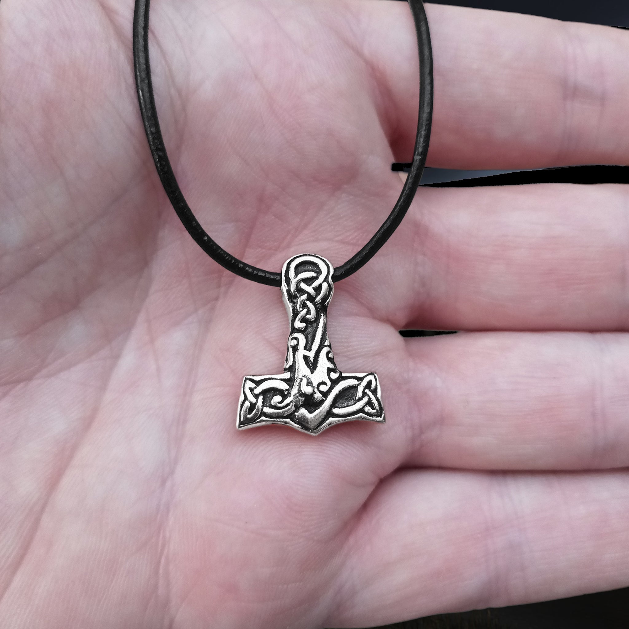 Small Silver Interlace Thors Hammer Viking Pendant on Leather Thong on Hand
