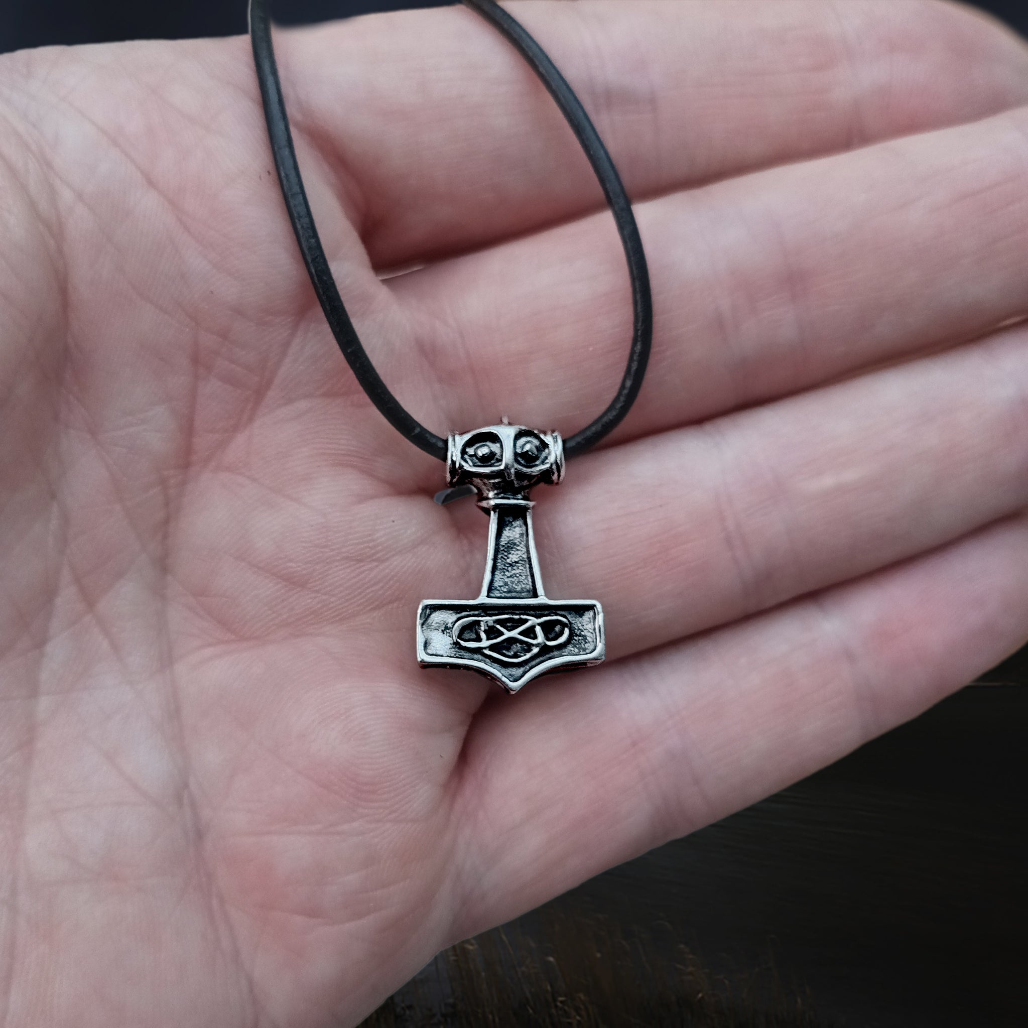 Small Silver Thunder Thors Hammer Viking Pendant on Leather Thong on Hand