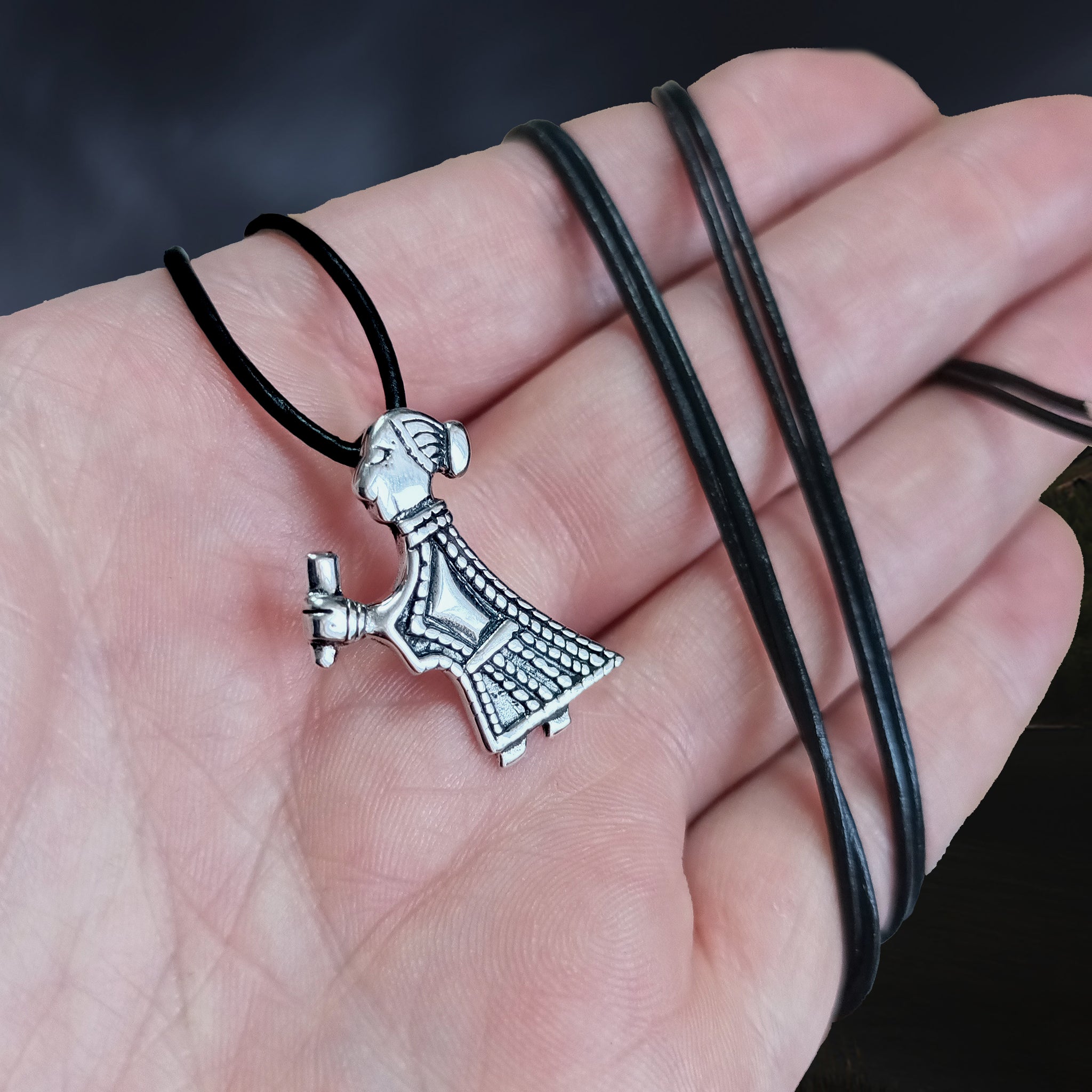 Replica Mythical Viking Valkyrie Pendant in 925 Sterling Silver on Leather Thong on Hand - Angle View