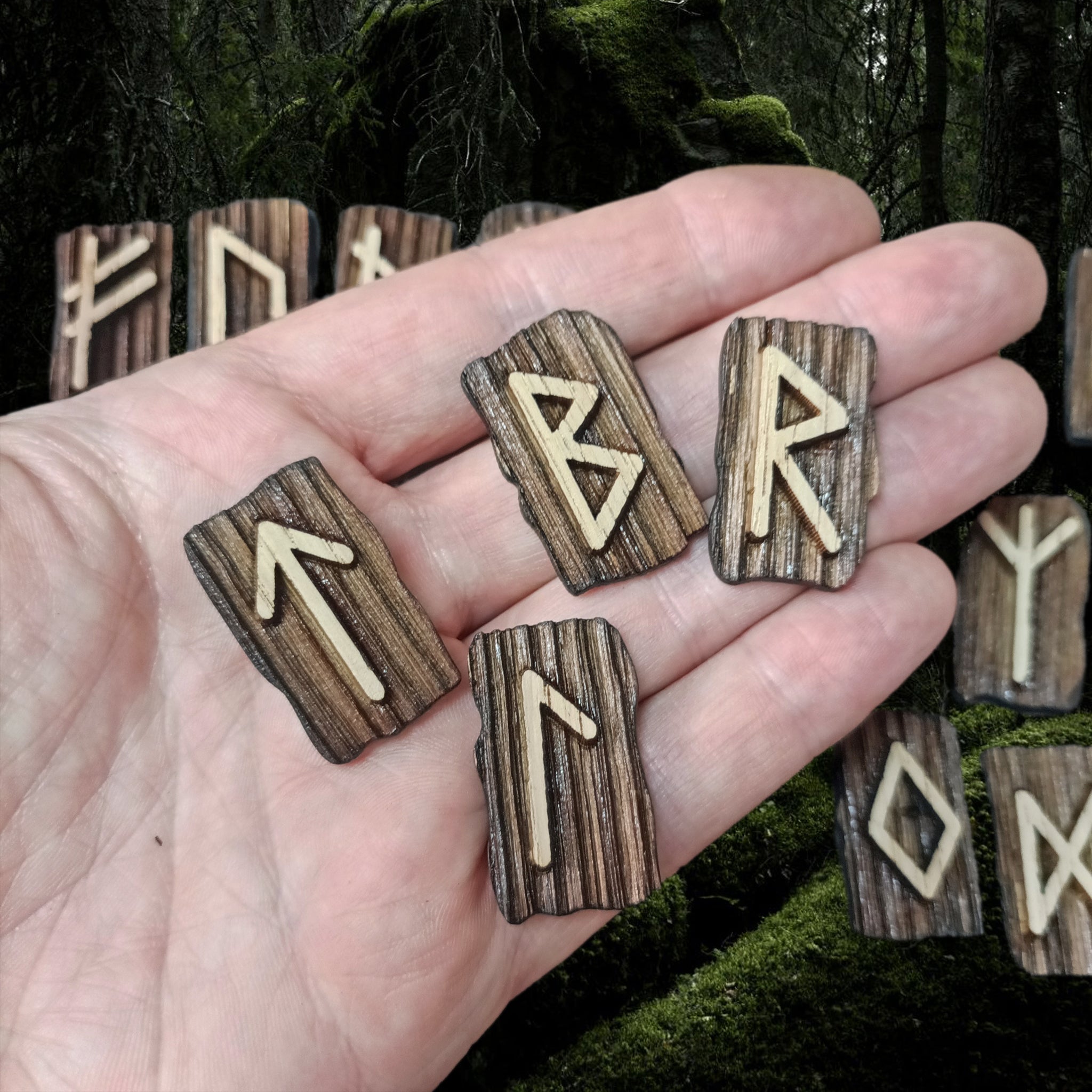 Elder Futhark Wooden Runes in hand with Runes Below