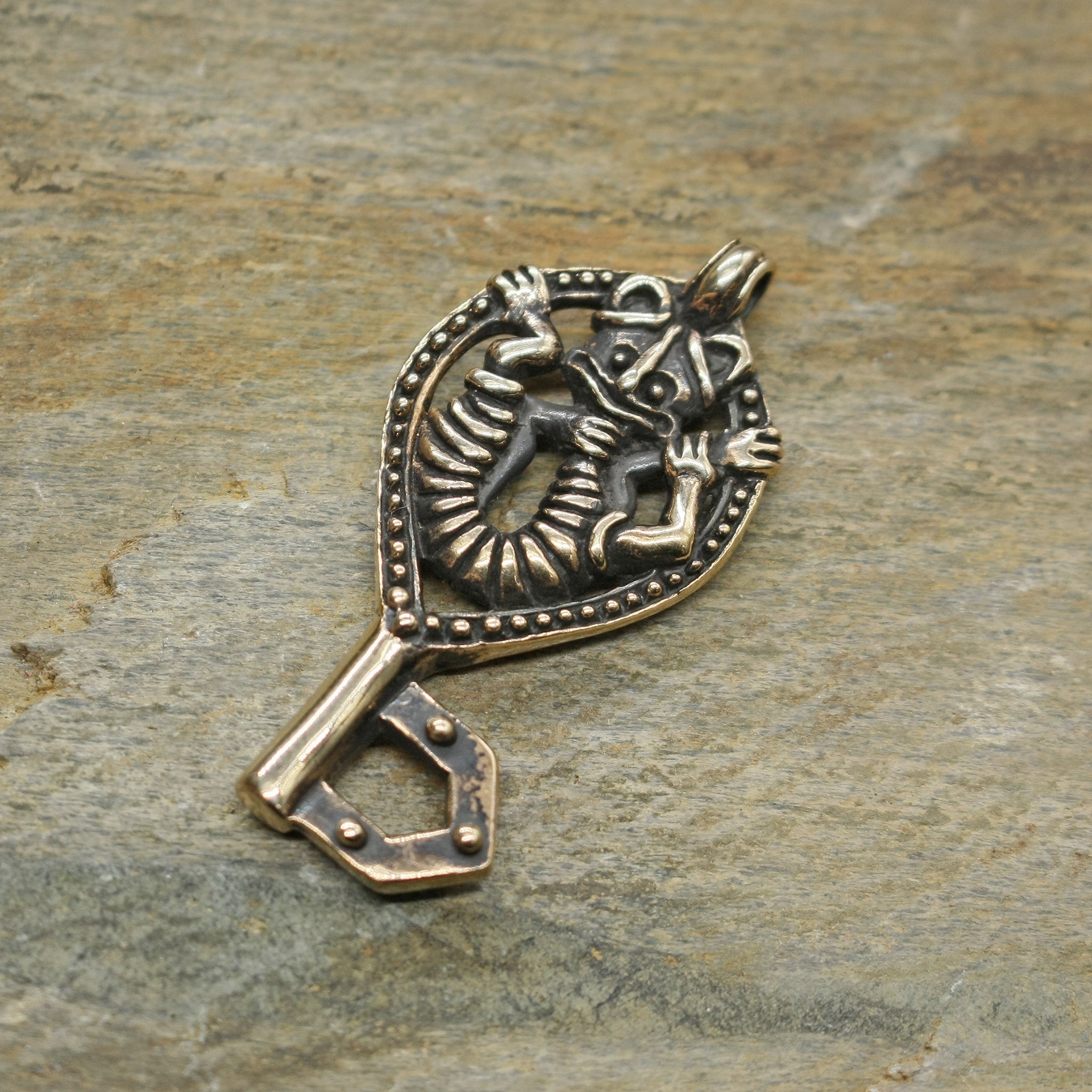 Bronze Viking Gripping Bear Key Pendant on Rock