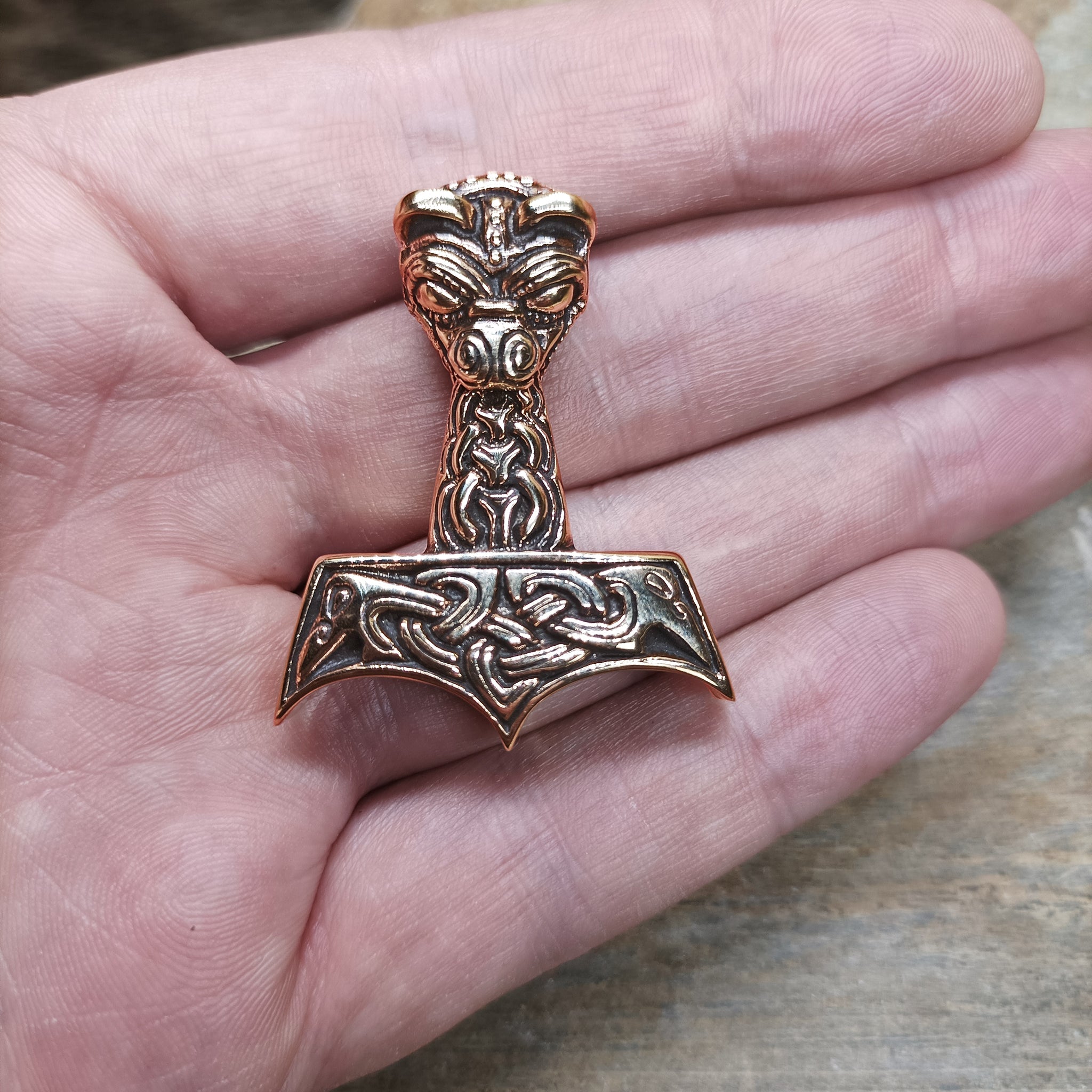 Bronze Large And Ferocious Thors Hammer Pendant on Hand