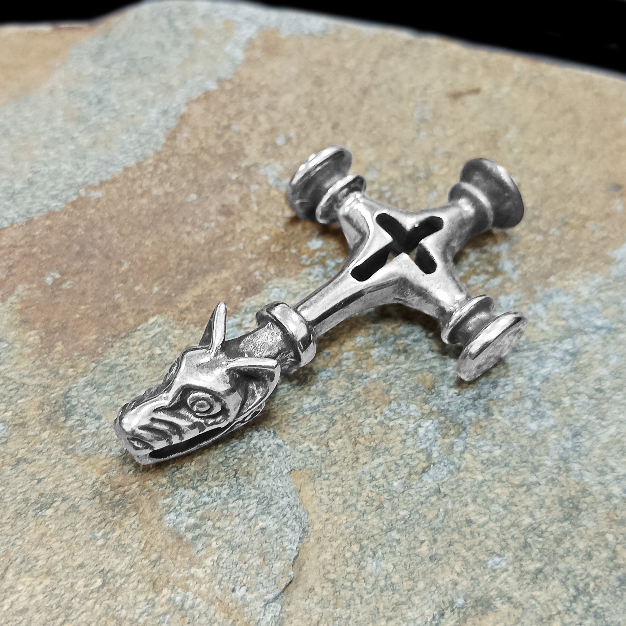 Large Icelandic Wolf Cross Hammer Replica Pendant - Silver - On Rock - Side View