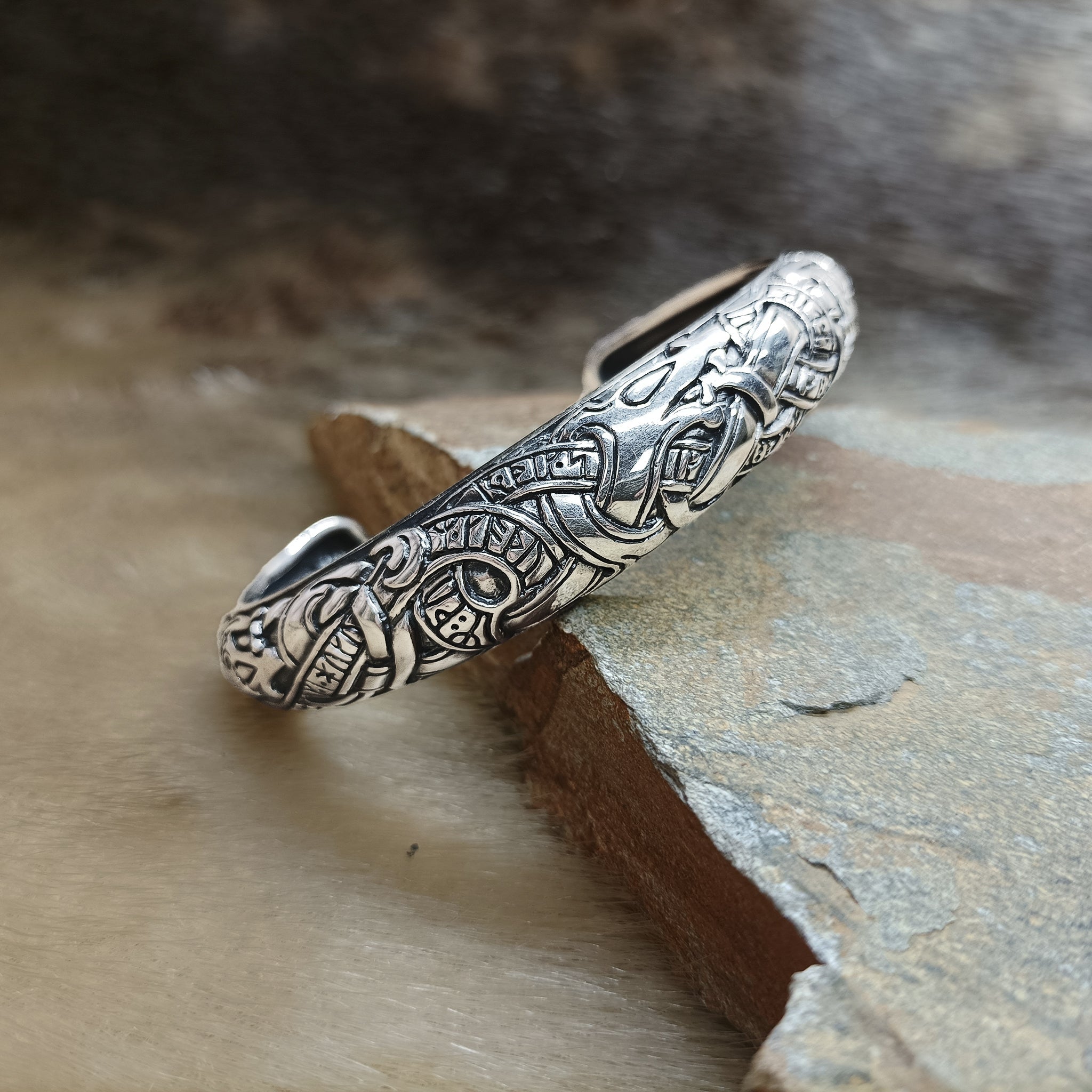 Silver Runic Viking Bracelet / Arm Ring on Rock - Front Angle View