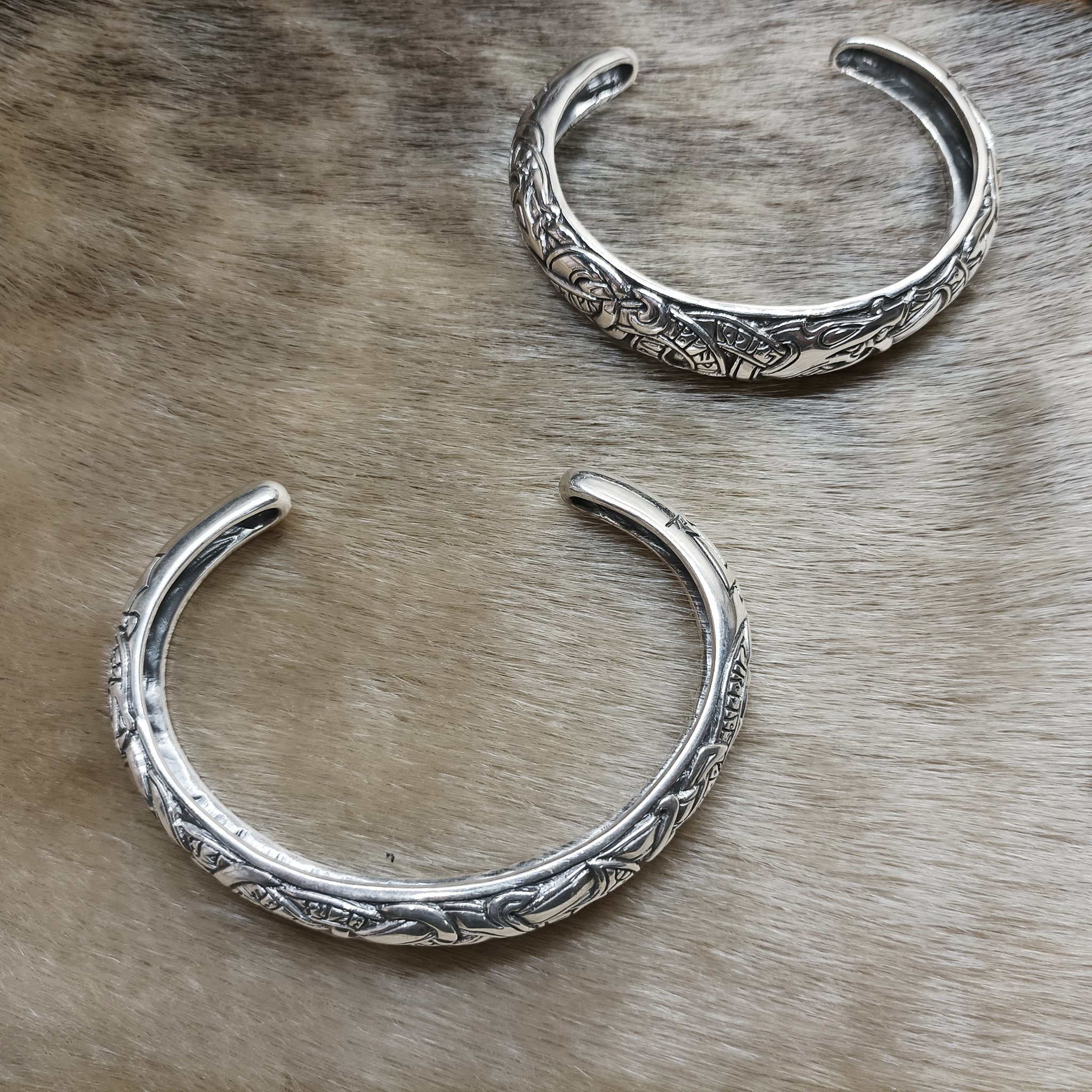 Silver Runic Viking Bracelets / Arm Rings on Fur - Size Comparisons